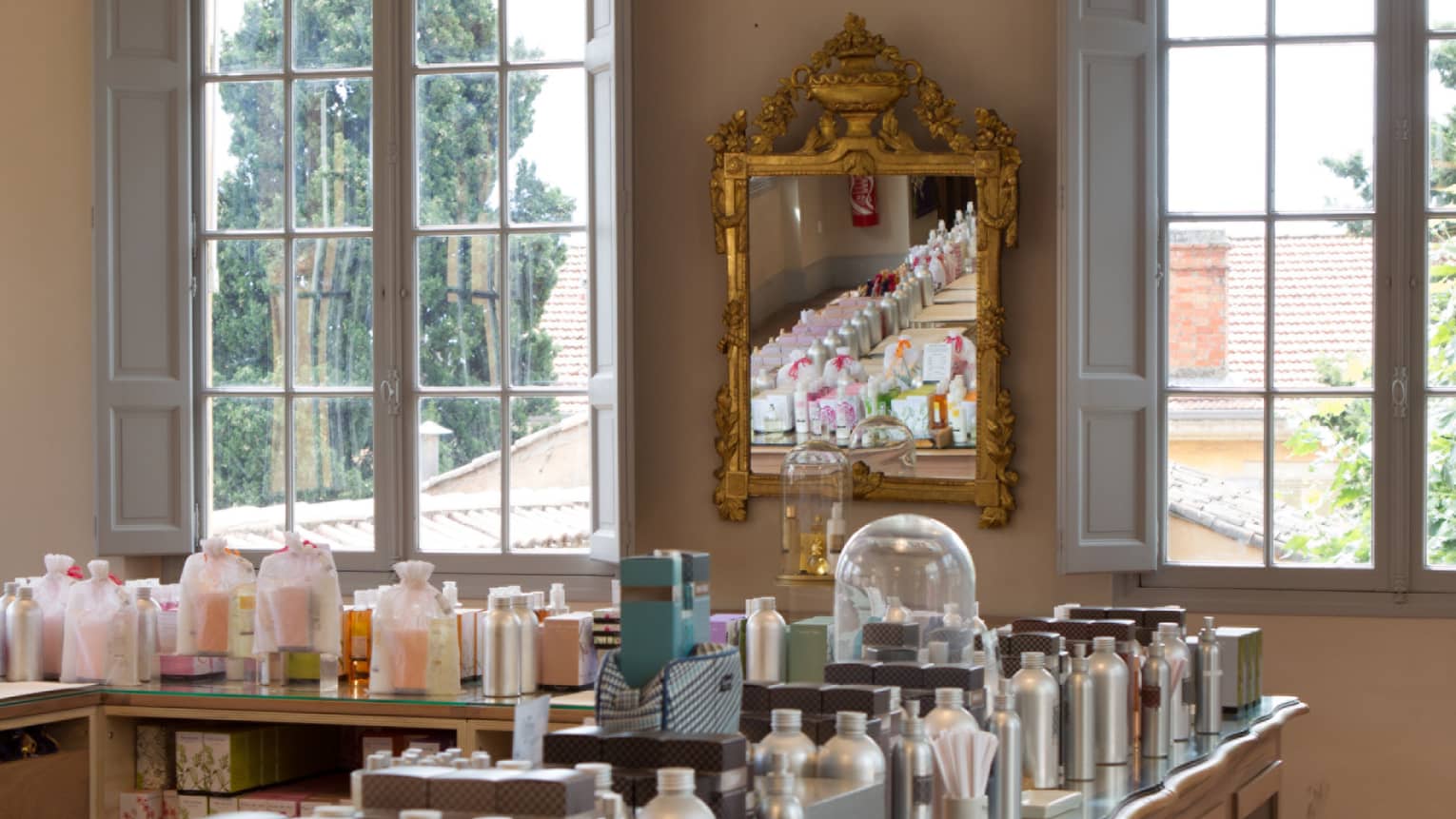 Fragonard parfumerie with fragrance bottles lining table