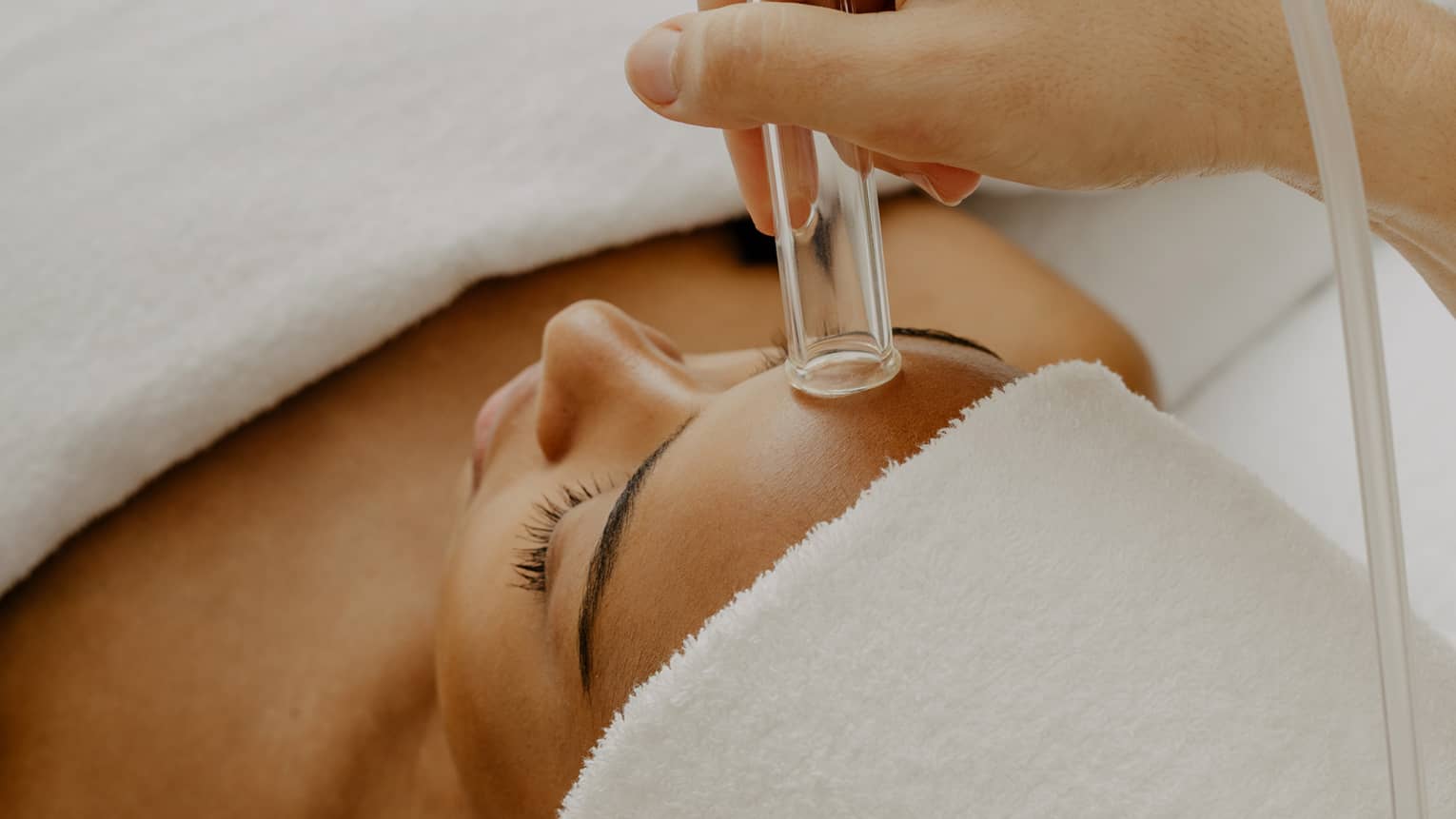 Woman gets a HydraFacial at spa