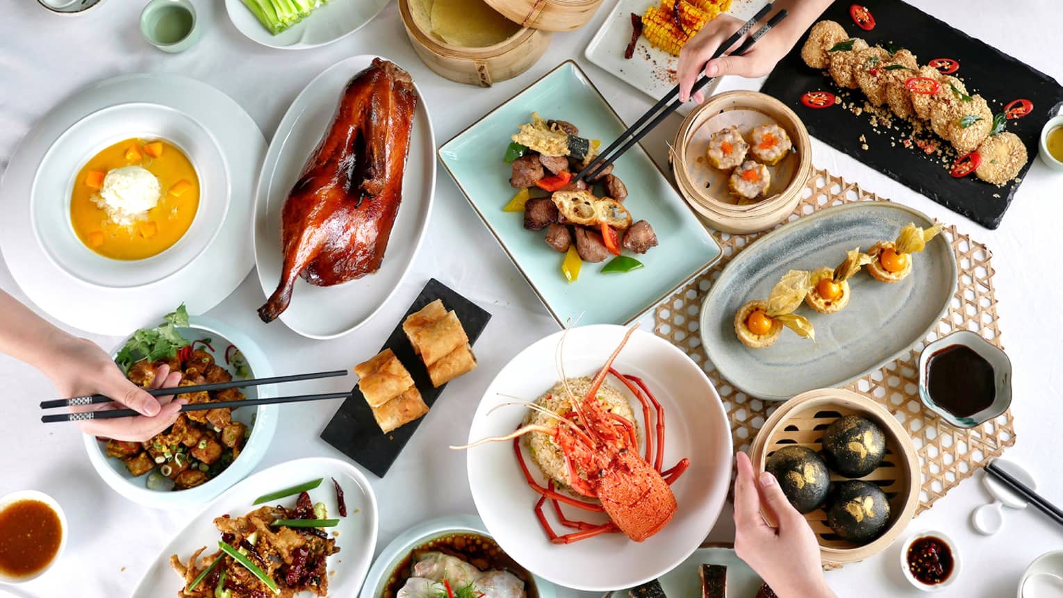 Aerial view of traditional Malaysian spread including peking duck, stone crab and Nasi Lemak
