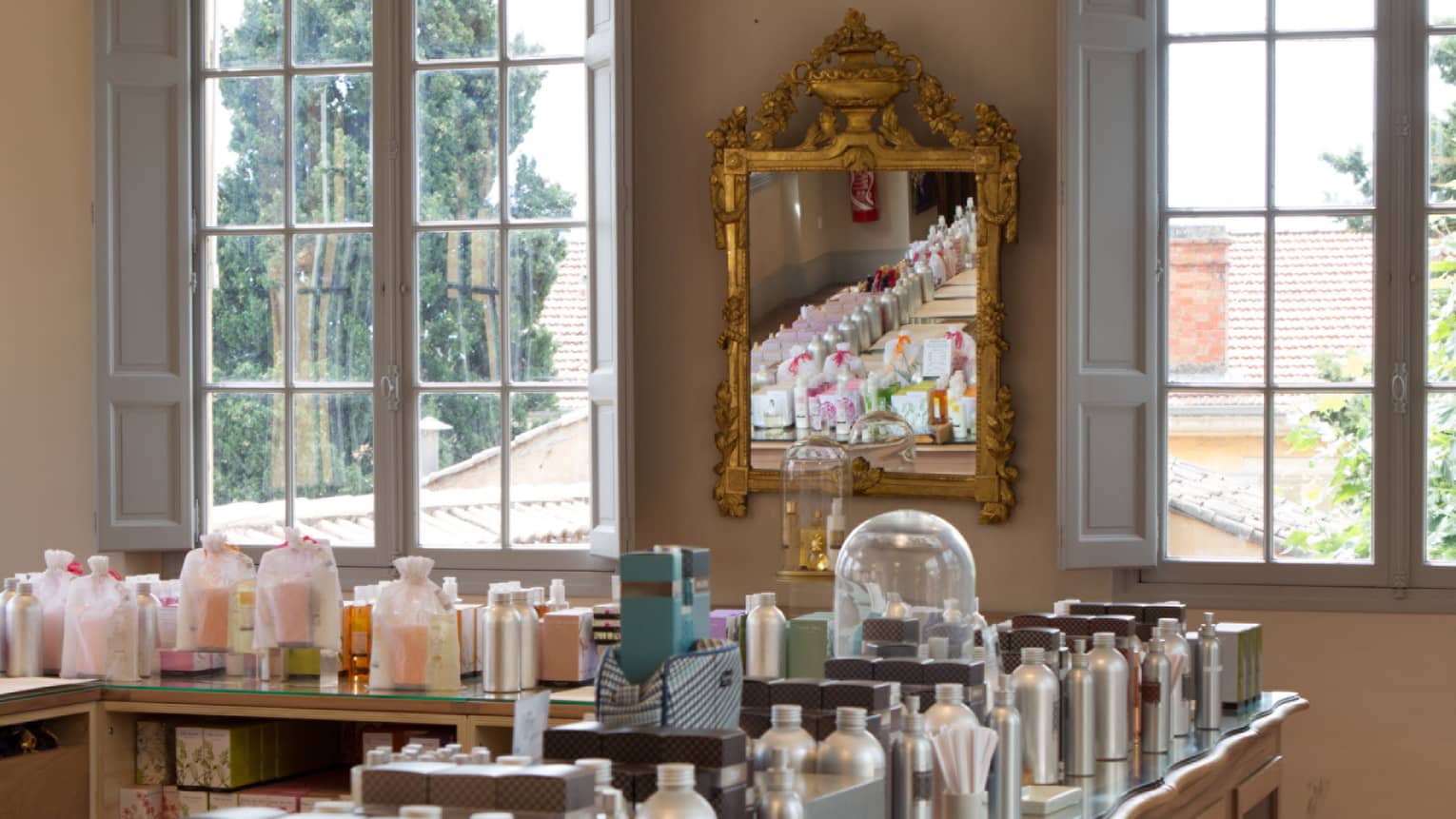 Fragonard parfumerie with fragrance bottles lining table