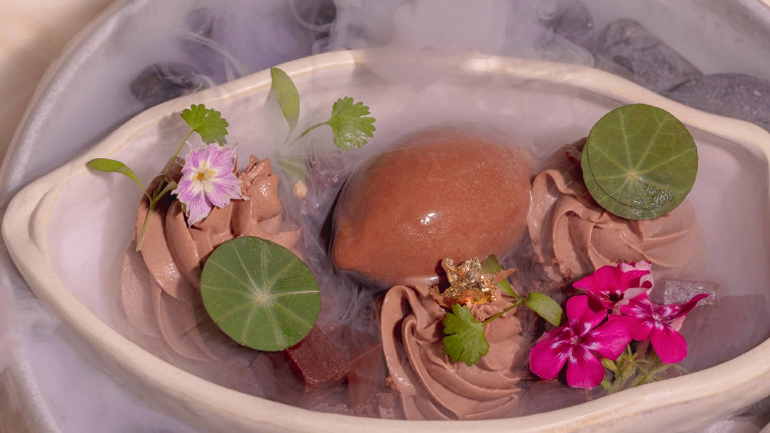 Textures of cocoa in a cloche filled with smoke