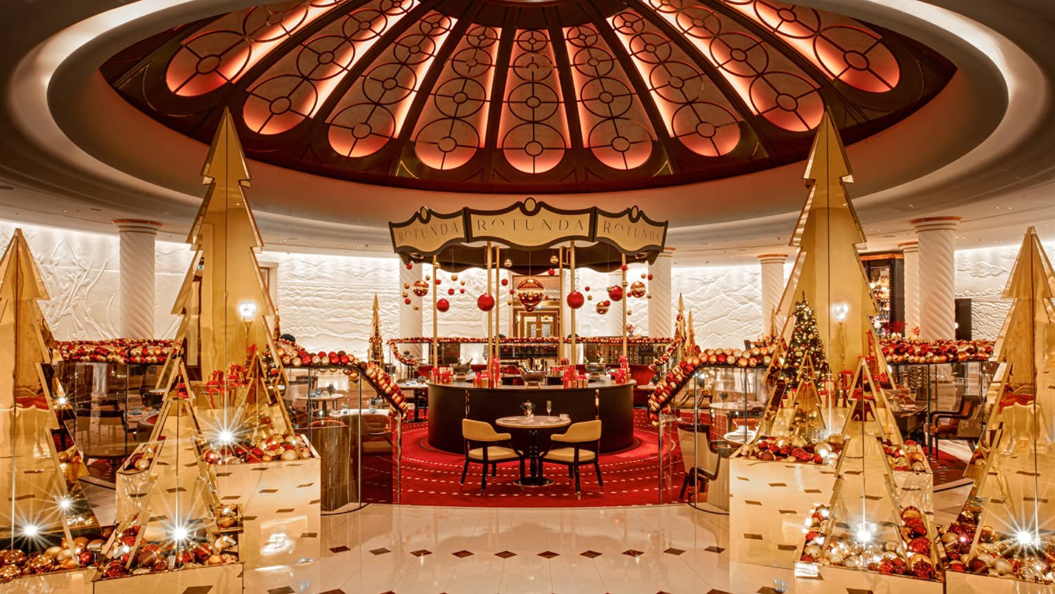 Rotunda with domed ceiling embellished with red and white Christmas decor