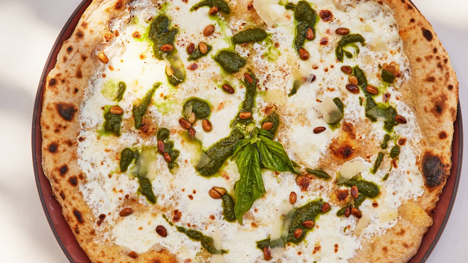 Flatbread topped with cheese and pesto