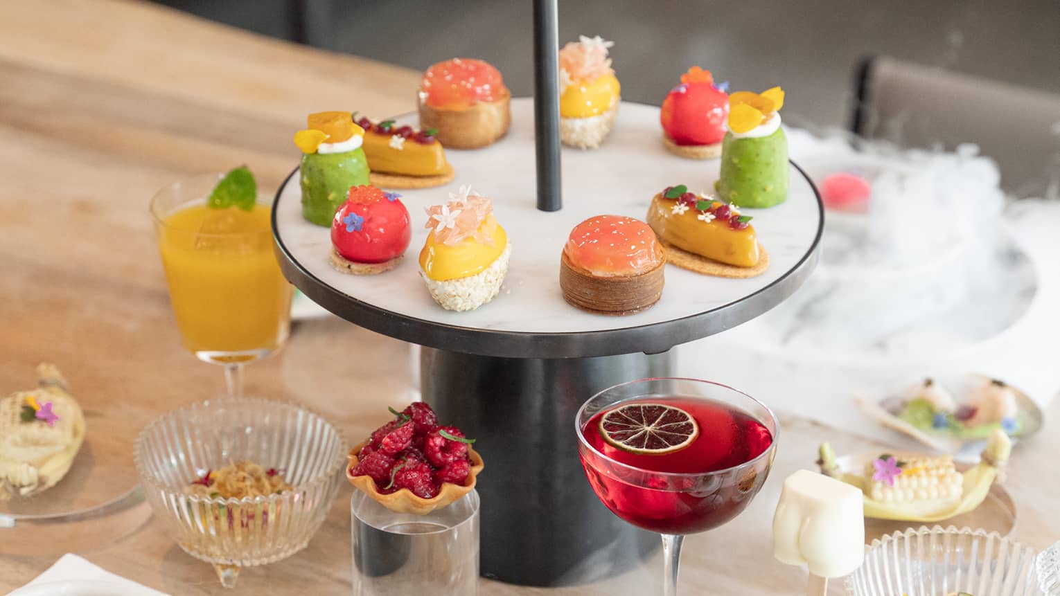 Single tier afternoon tea display with colourful sweet treats