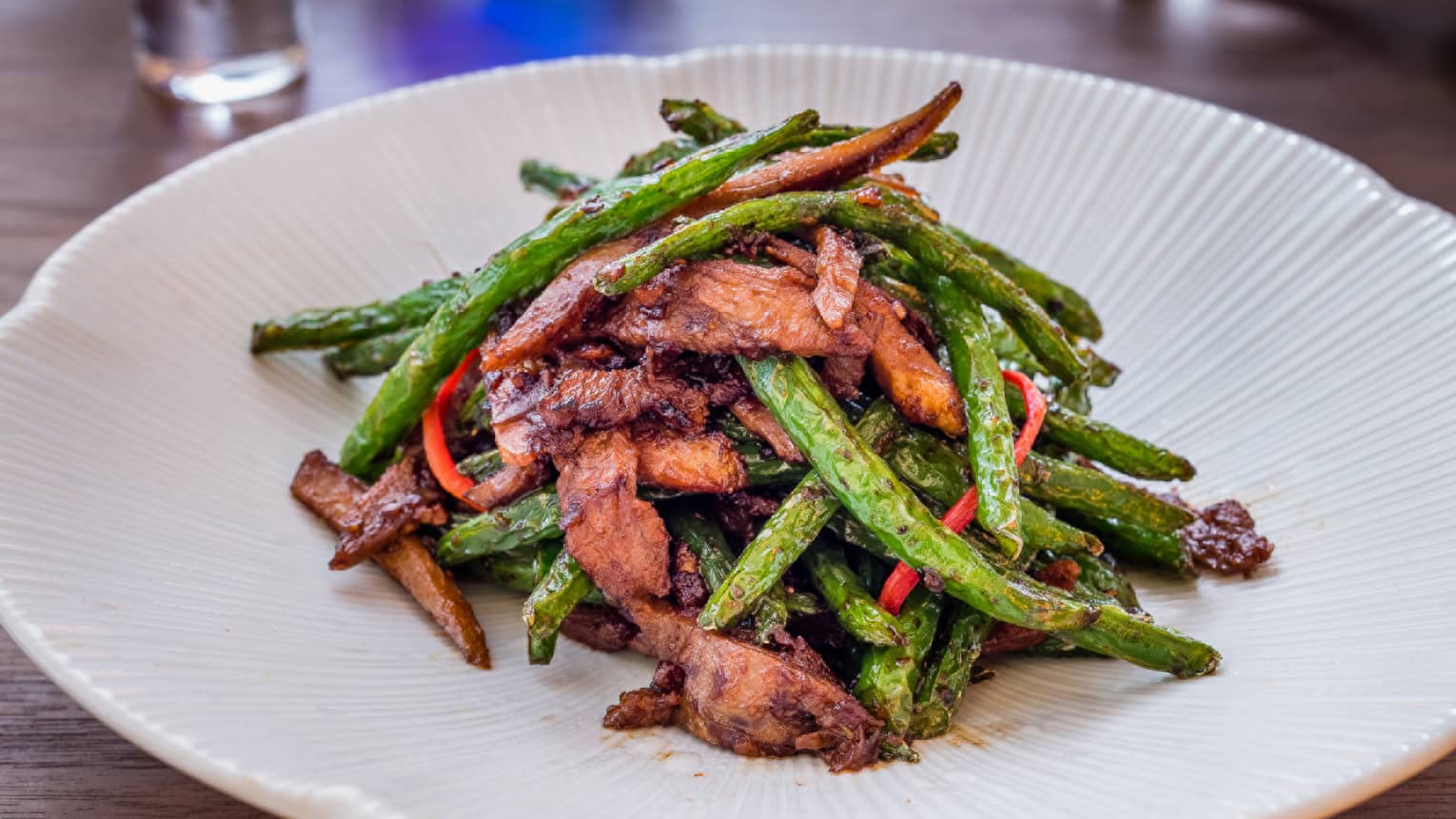 Mei Ume restaurant's wok fried sliced duck on white plate