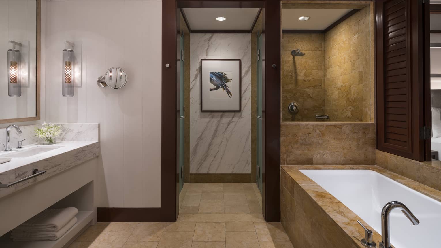 Bathroom Interior Featuring Bathtub, Shower, Sinks, and Interior Hallway