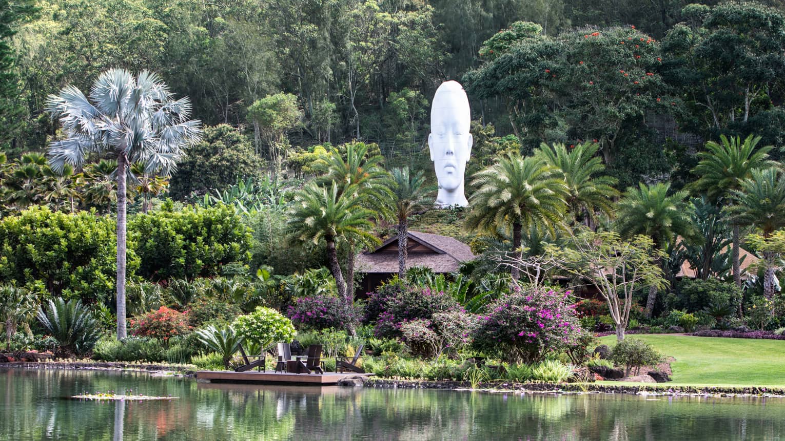 Lush tropical grounds of resort with sculpture head