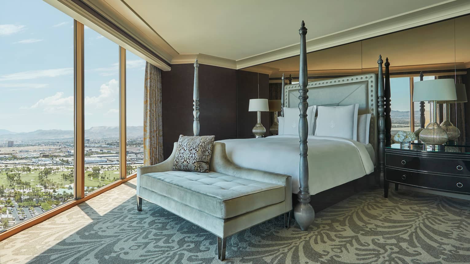 Sunrise Sunset Suite poster bed, tufted bench at foot, floor-to-ceiling window