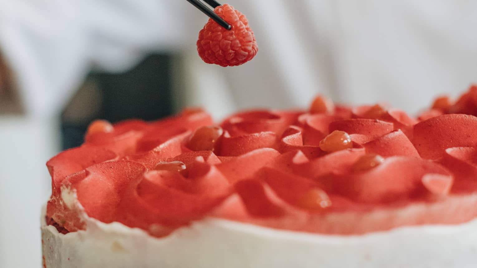 A white and red strawberry cake.