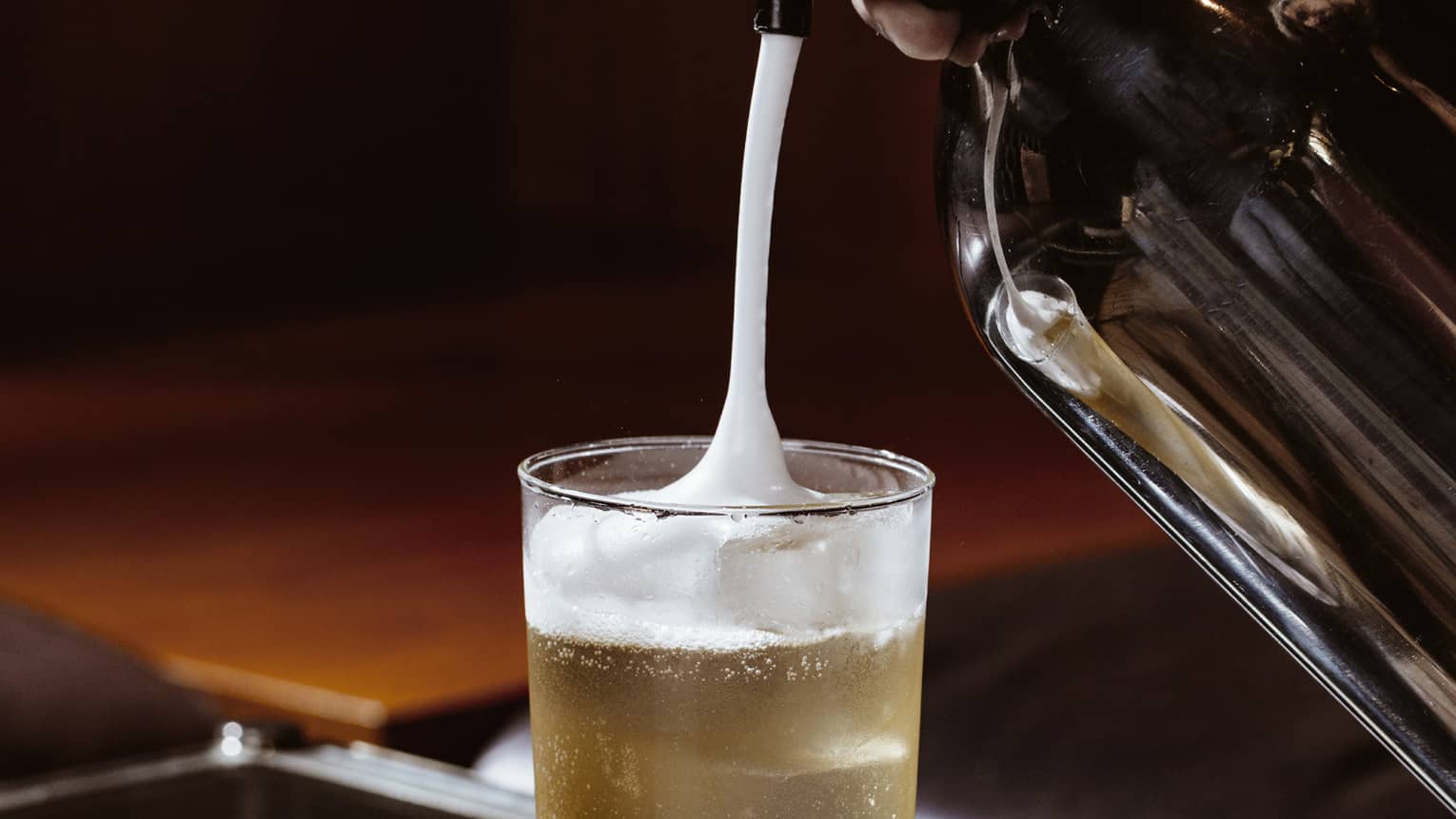 Foam being poured into a drink.