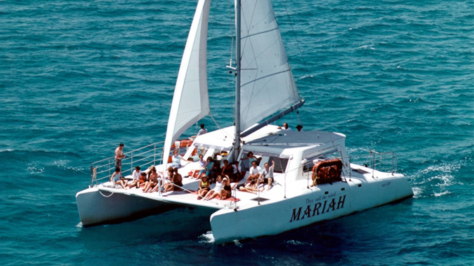 Large group lounge on catamaran sailboat Mariah on ocean