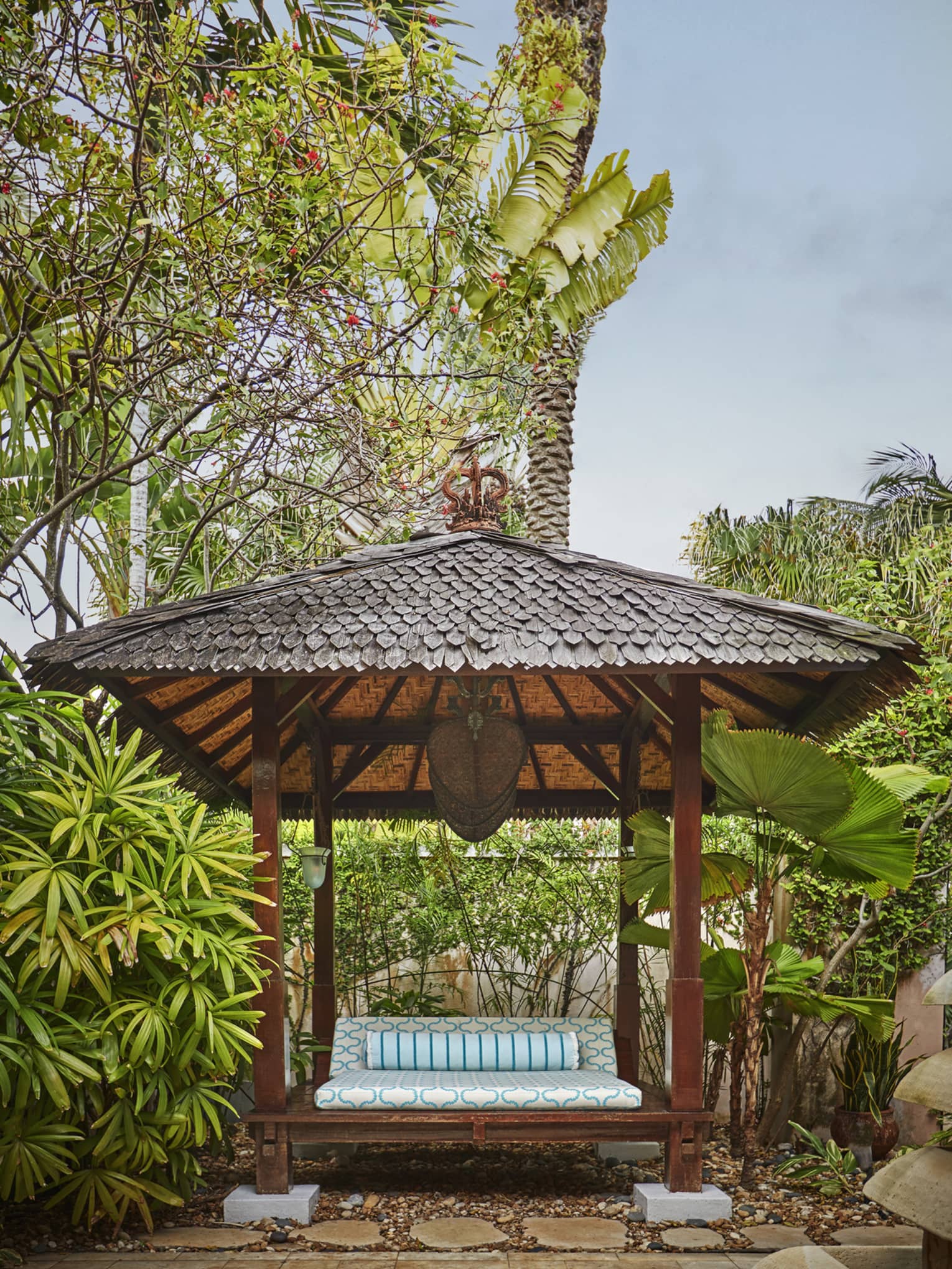 Seating in a spa courtyard surrounded by tropical plants