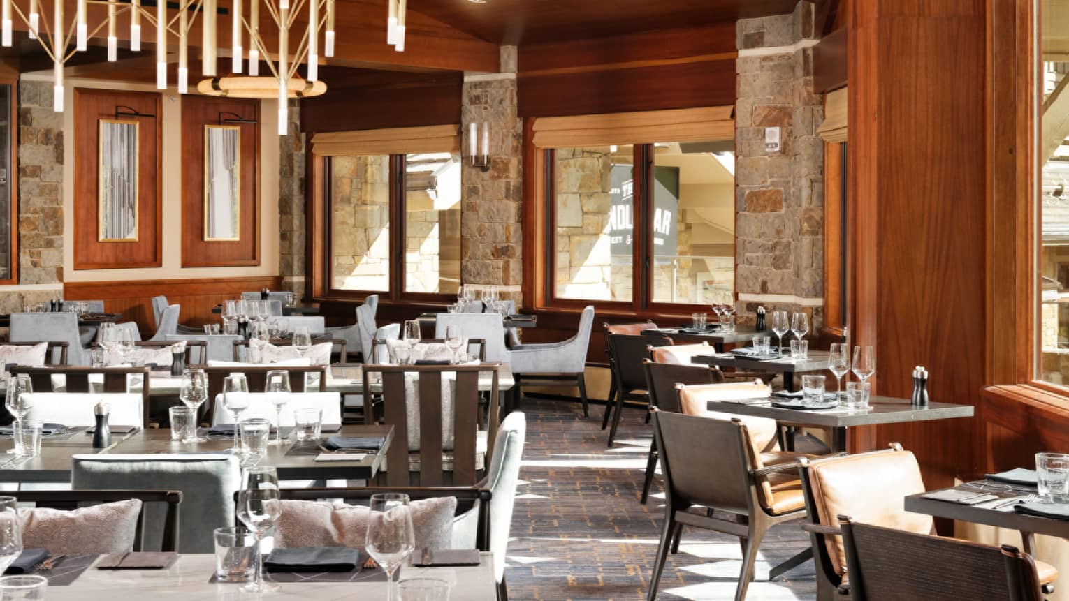 Empty restaurant, wooden ceiling and exposed beams, chandelier