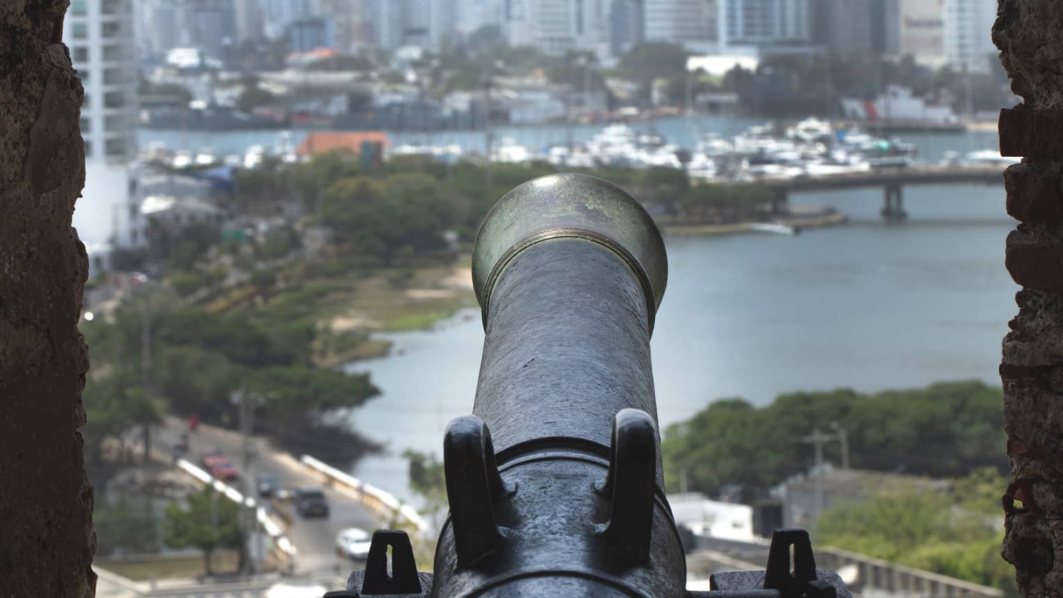 An antique cannon in a city setting