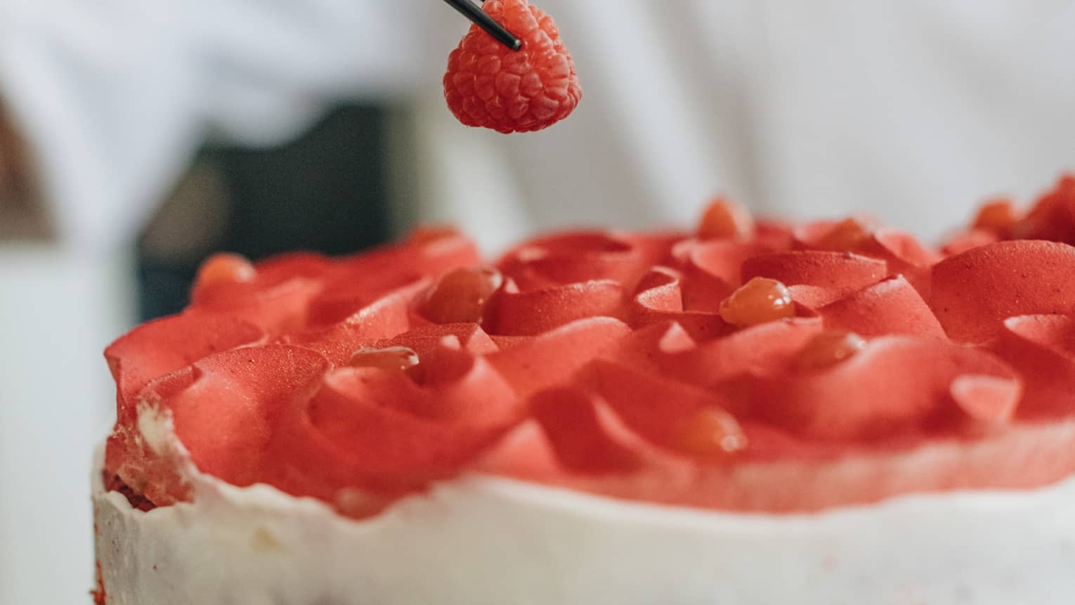 A white and red strawberry cake.