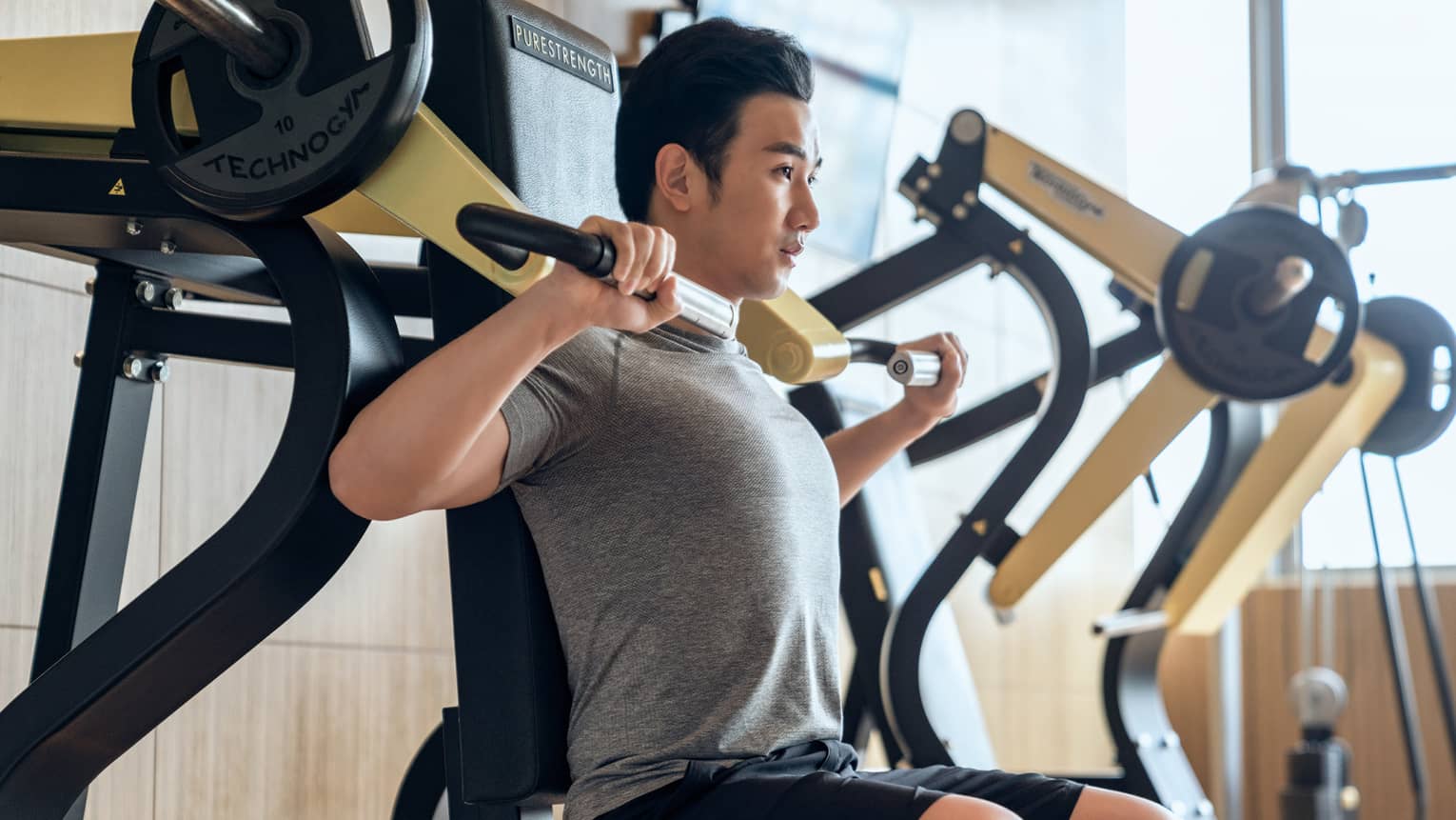 Guest using fitness equipment in gym at Four Seasons
