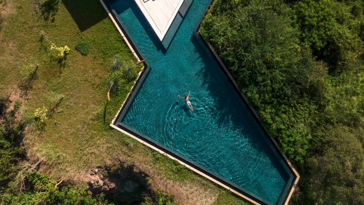 Aerial view of geometric pool of private villa