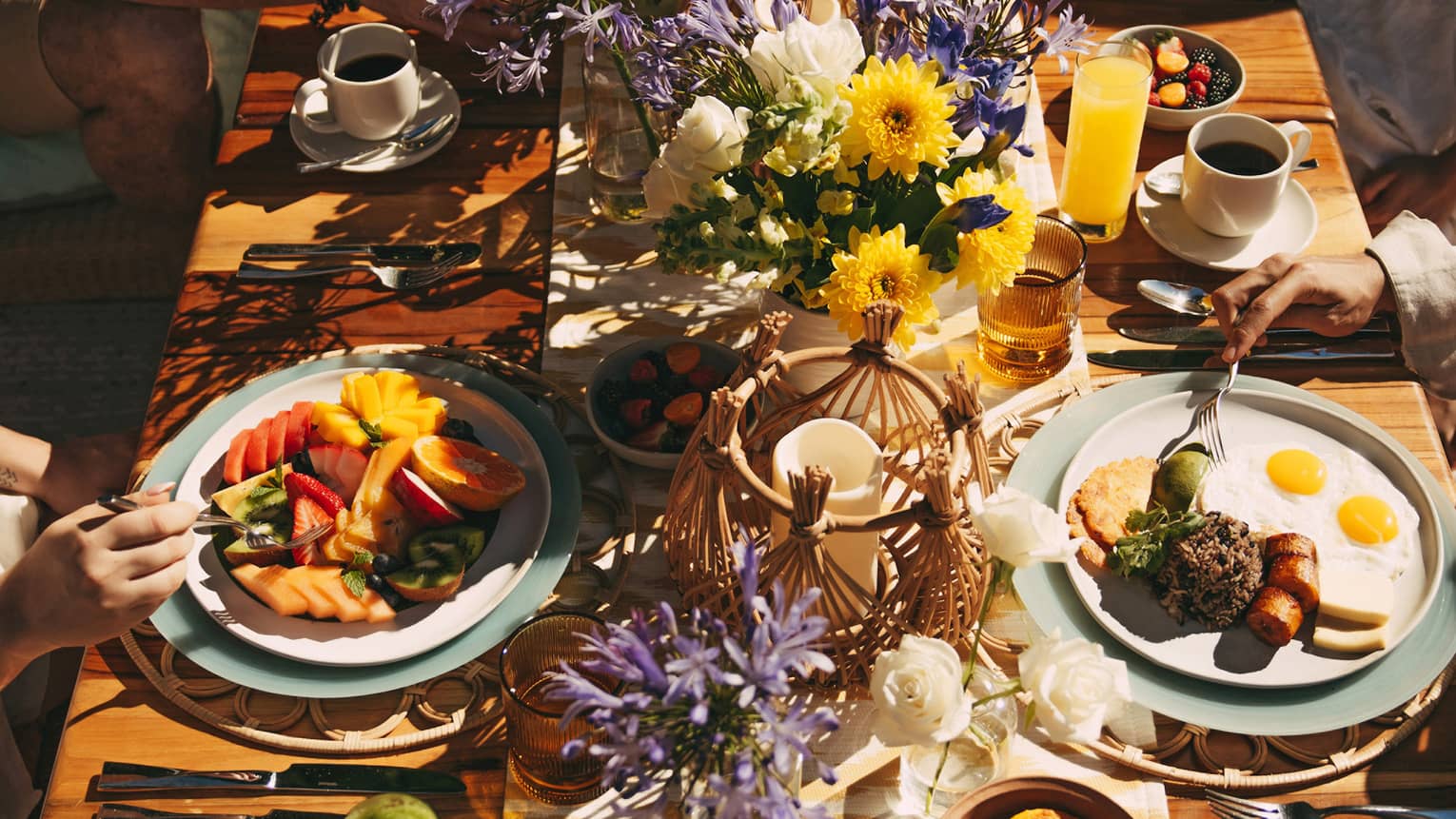 Outdoor table filled with food and florals