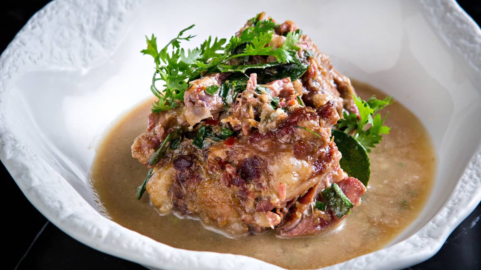 Tom Yum Kha Moo – Smoky sour soup, roasted pork leg, tamarind, fried garlic