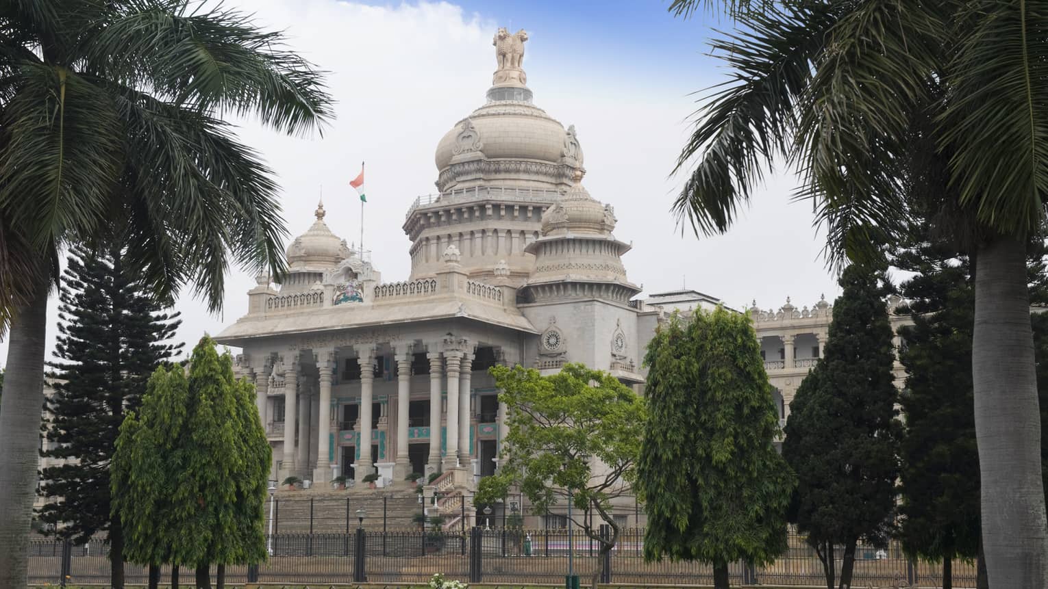 Palm trees in front of Vidhana Soudha government building exterior