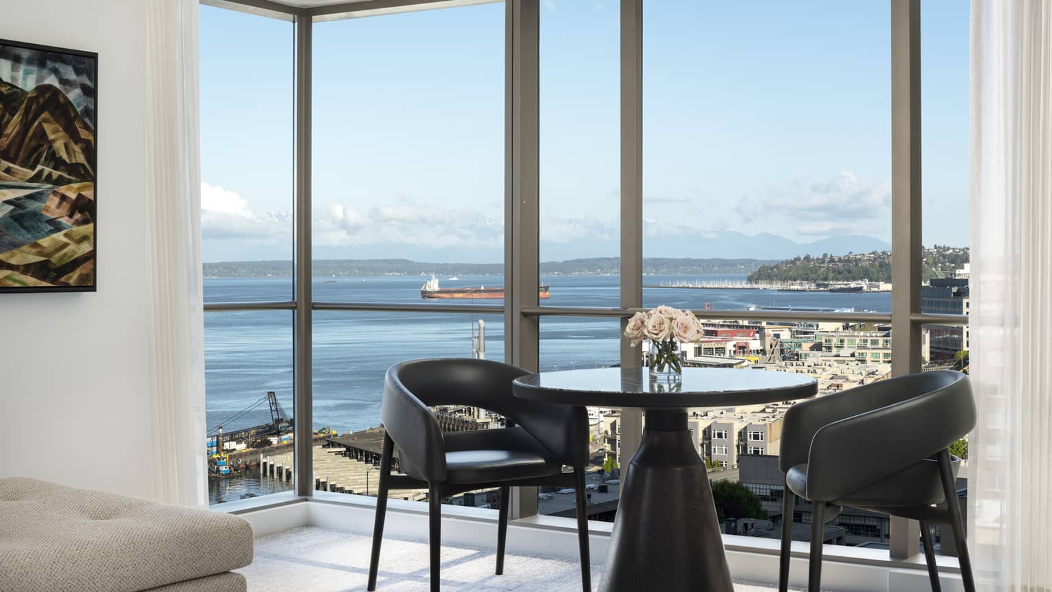 A table in the corner of the Prime Bay View Room overlooks the water and colorful buildings below