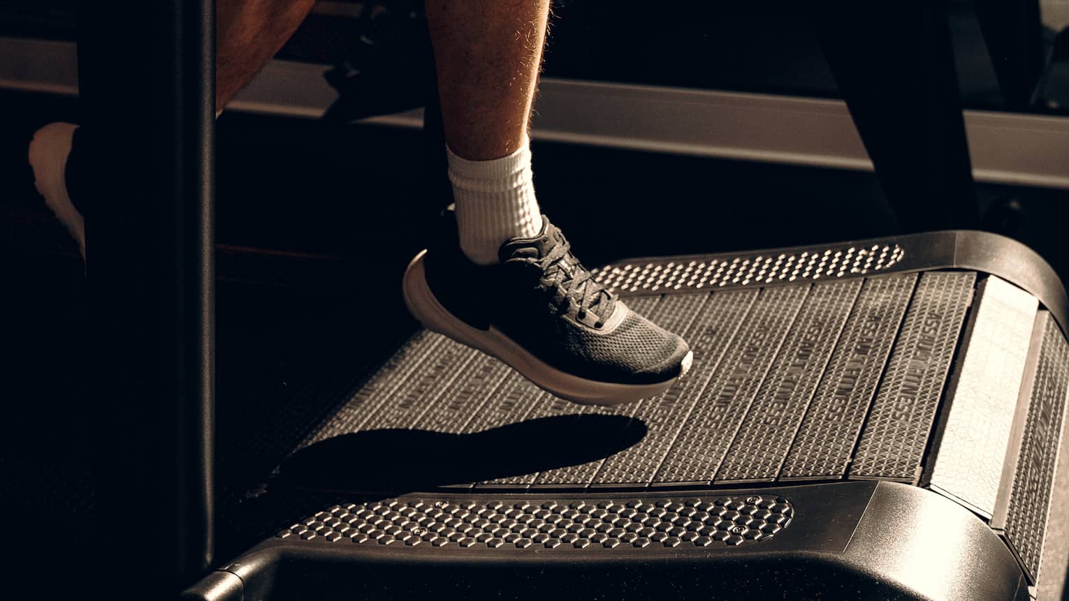 Person walking on an exercise machine.