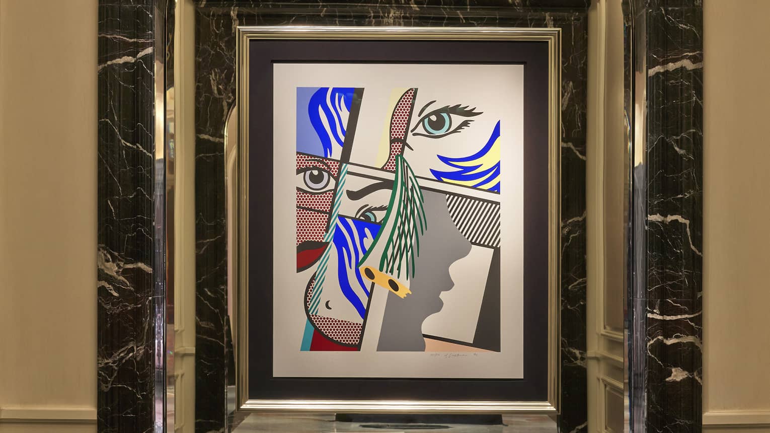Close-up of Roy Lichtenstein’s pop art print, Modern Art II, with primary colour facial features arranged abstractly.