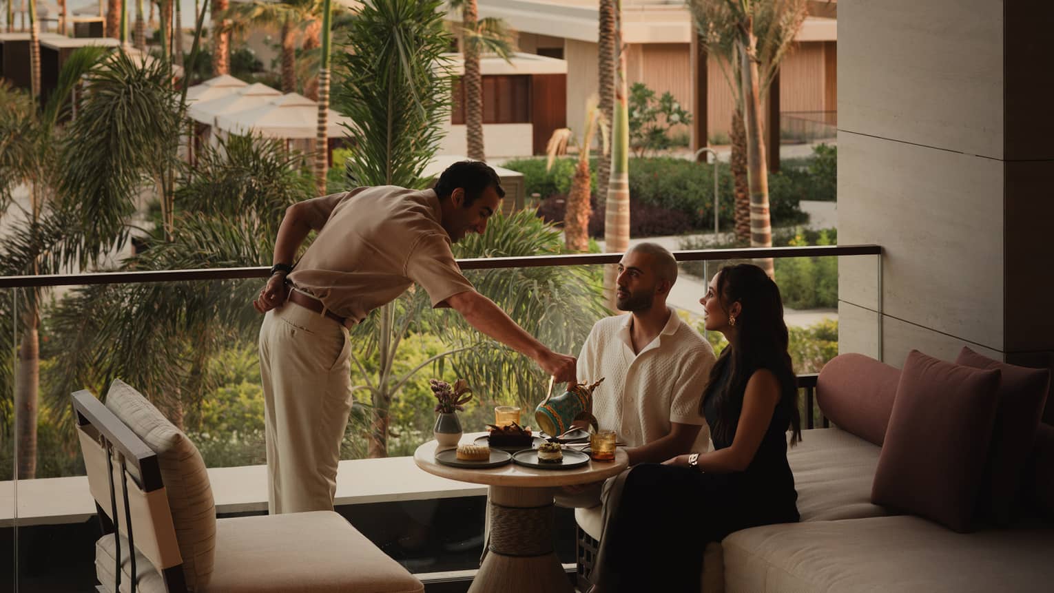 Two people are served at modern resort lounge