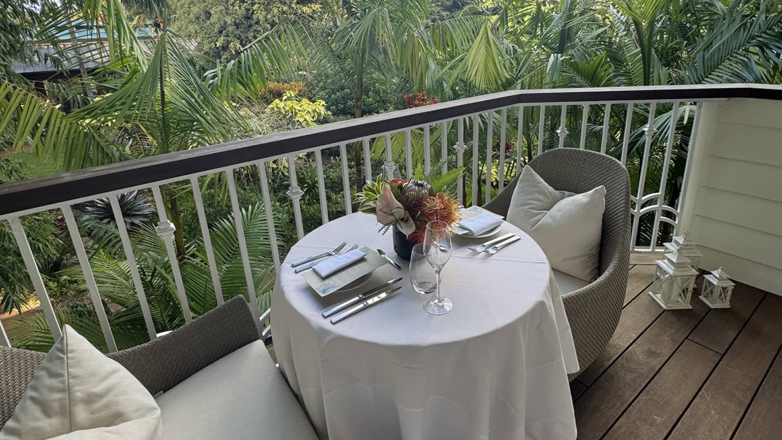 Outdoor private dining on a patio with a view of green tees.