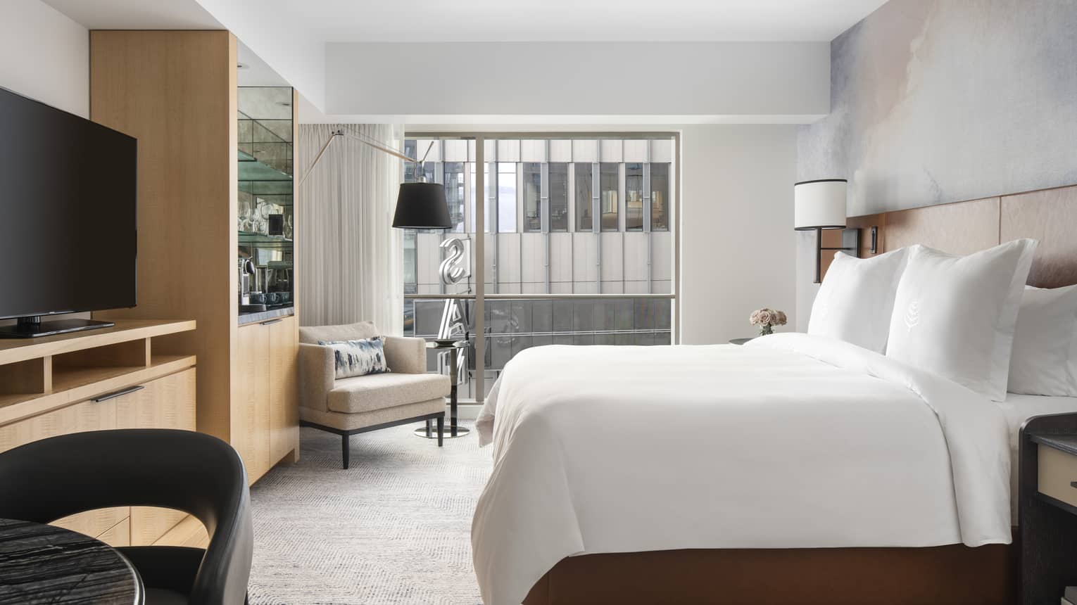 Contemporary Seattle-view rooms feature plush king beds and floor-to-ceiling windows