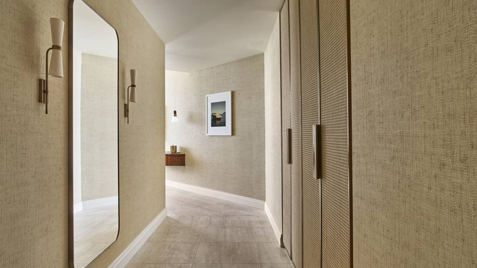 Hotel hallway lined with linen wallpaper