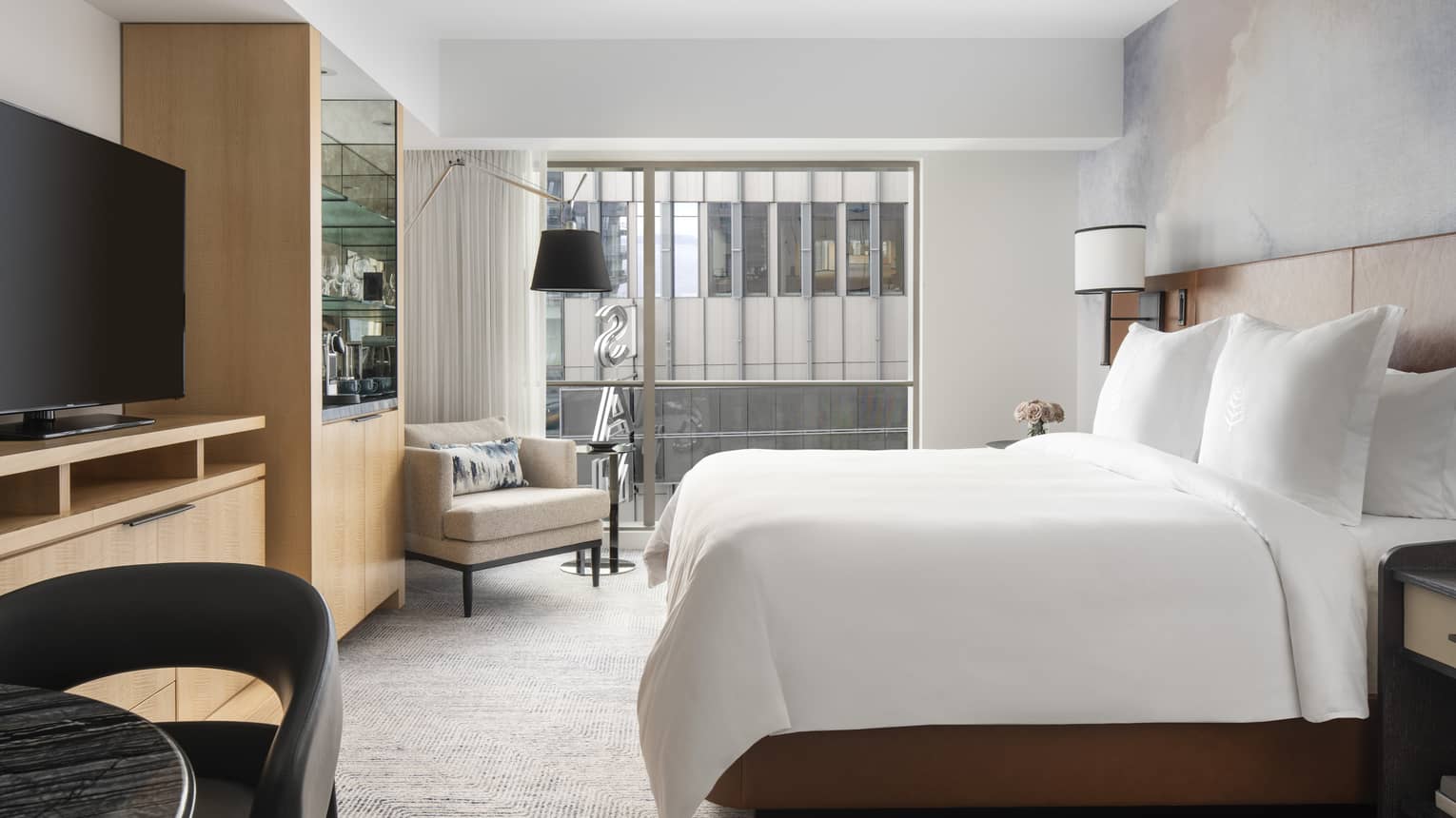 Contemporary Seattle-view rooms feature plush king beds and floor-to-ceiling windows