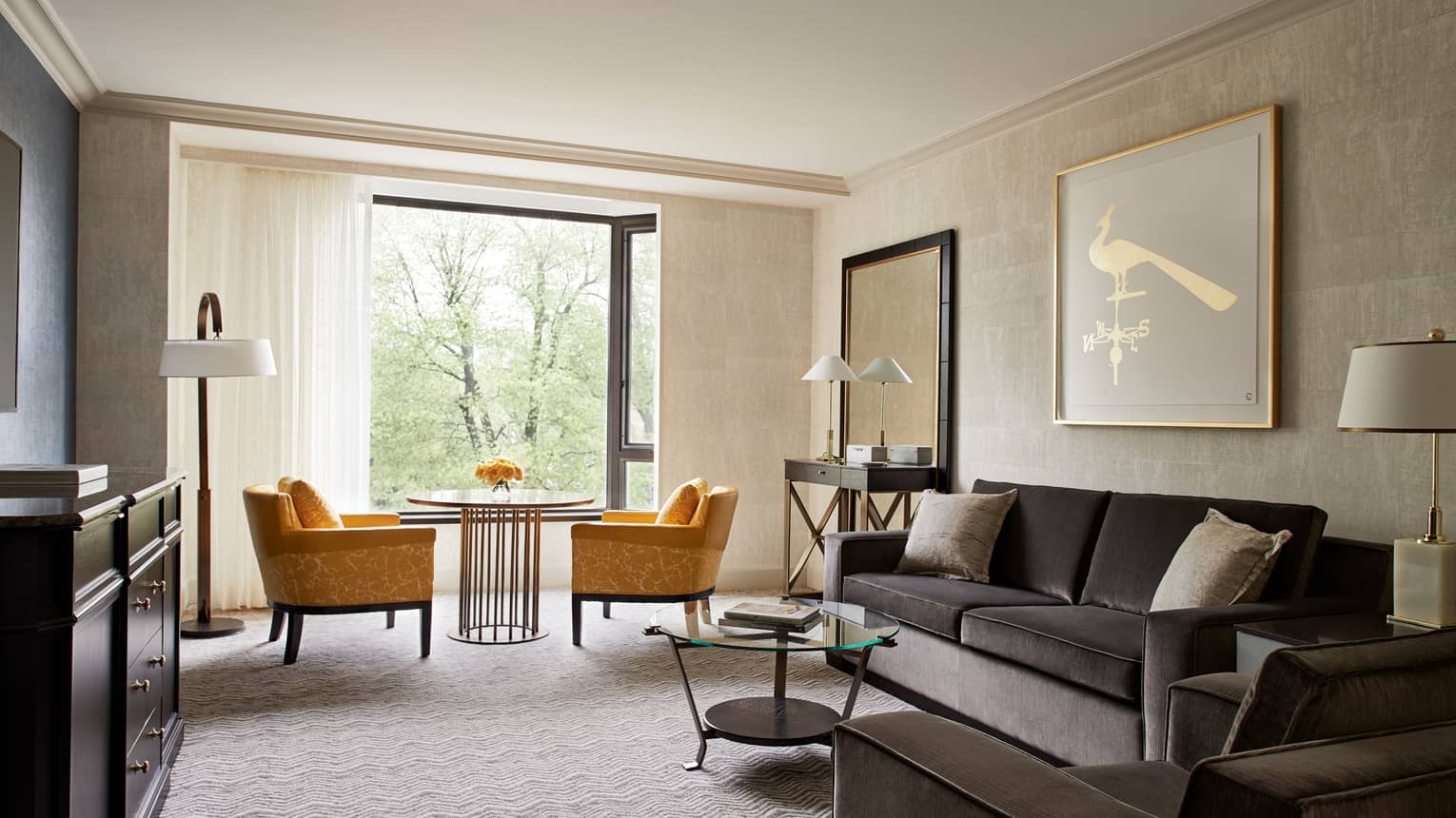 Garden View Executive Suite grey velvet sofa and armchair, golden yellow plush armchairs beside bright window