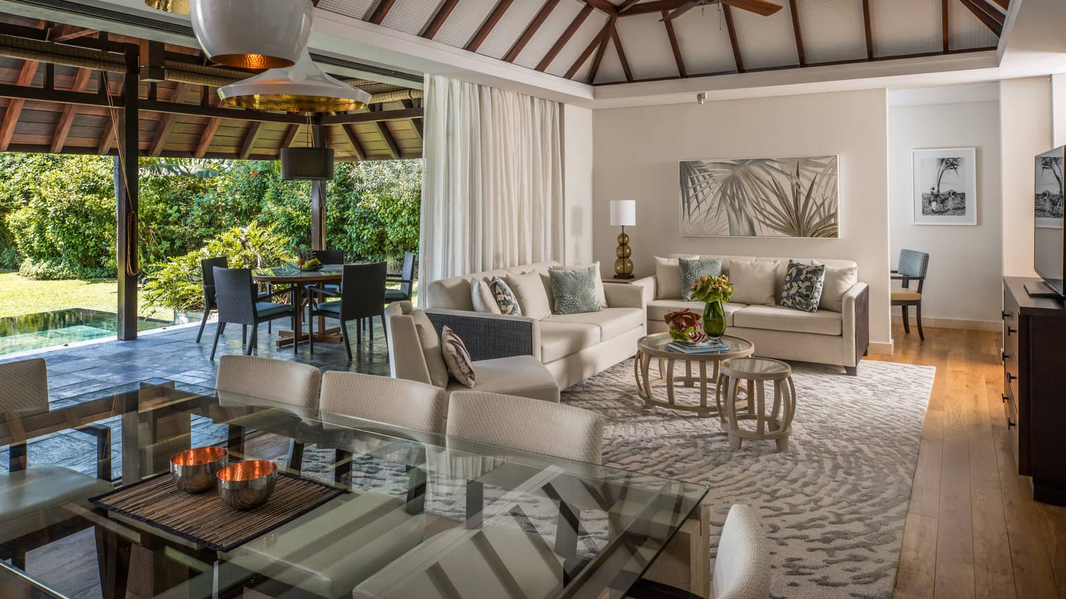 Garden Residence Villa large dining table, modern lights from cathedral ceilings, living room