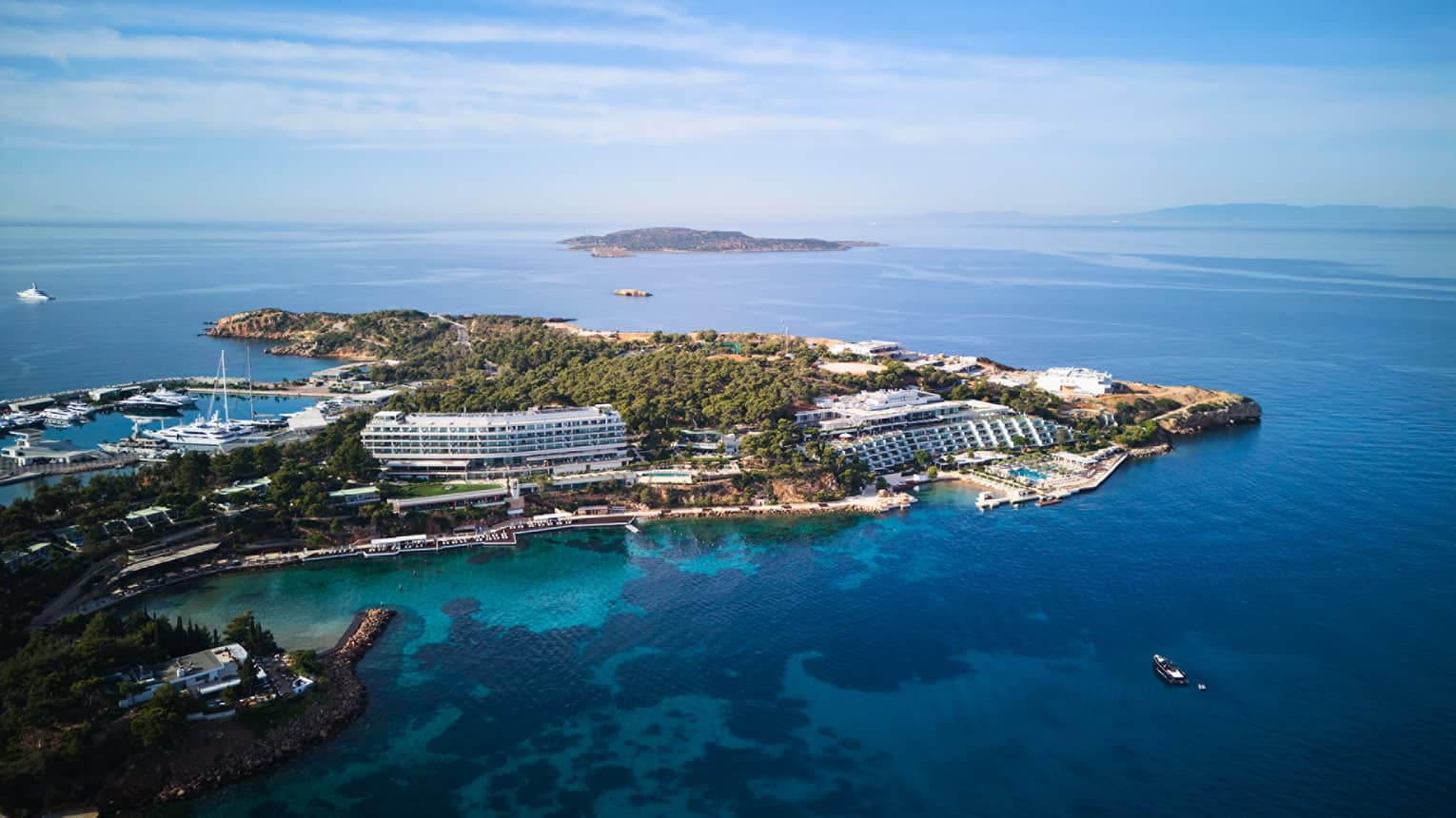 Aerial view of resort on a peninsula surrounded by blue sea