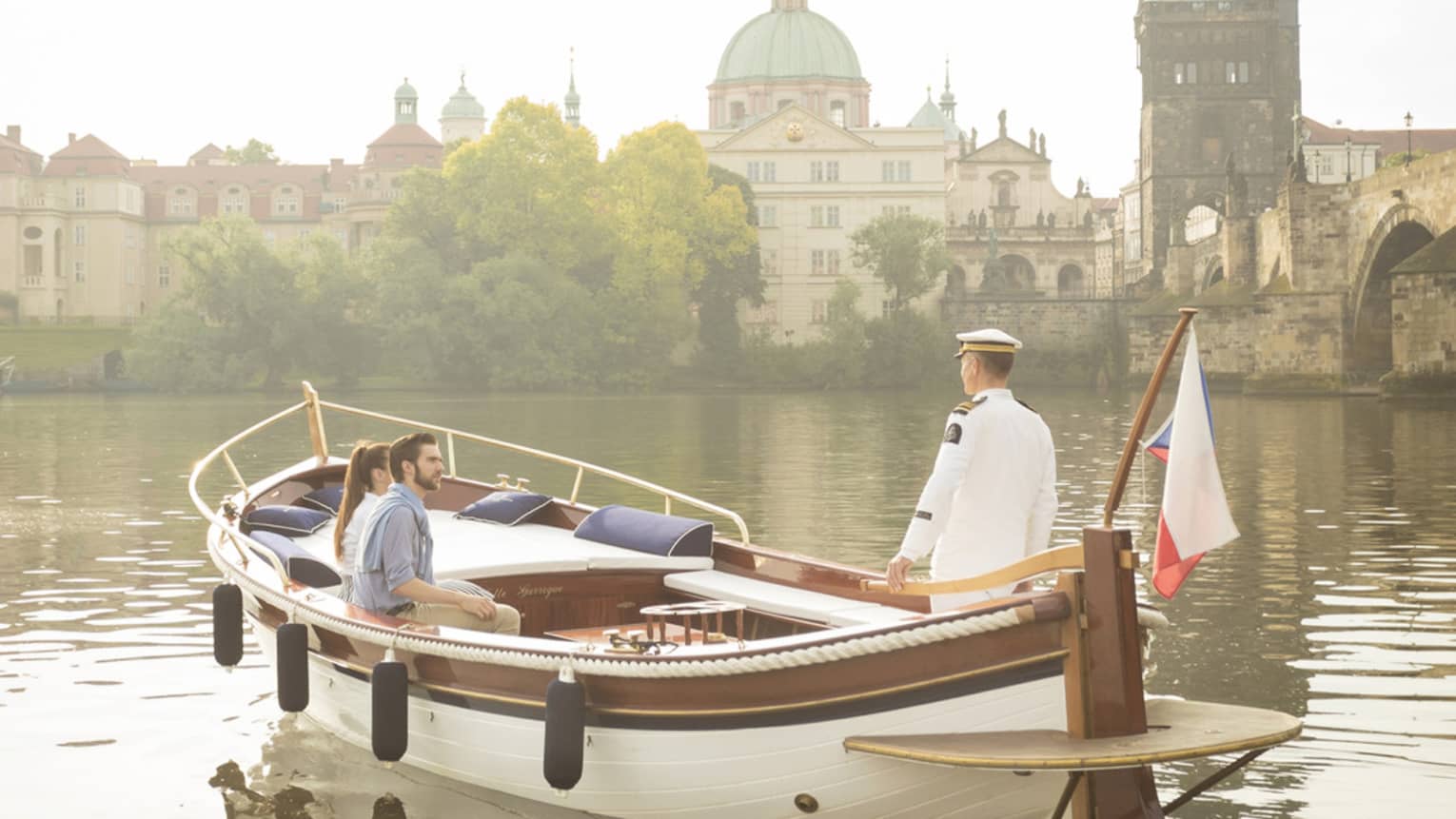Couple enjoying river boat trip in Prague