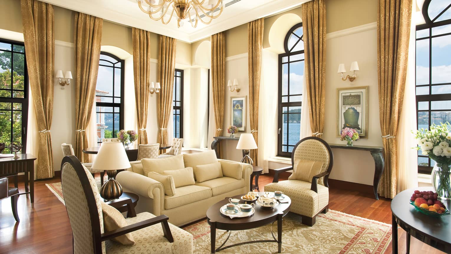 Two-Bedroom Bosphorus Palace Suite elegant seating area, ivory curtains on corner windows