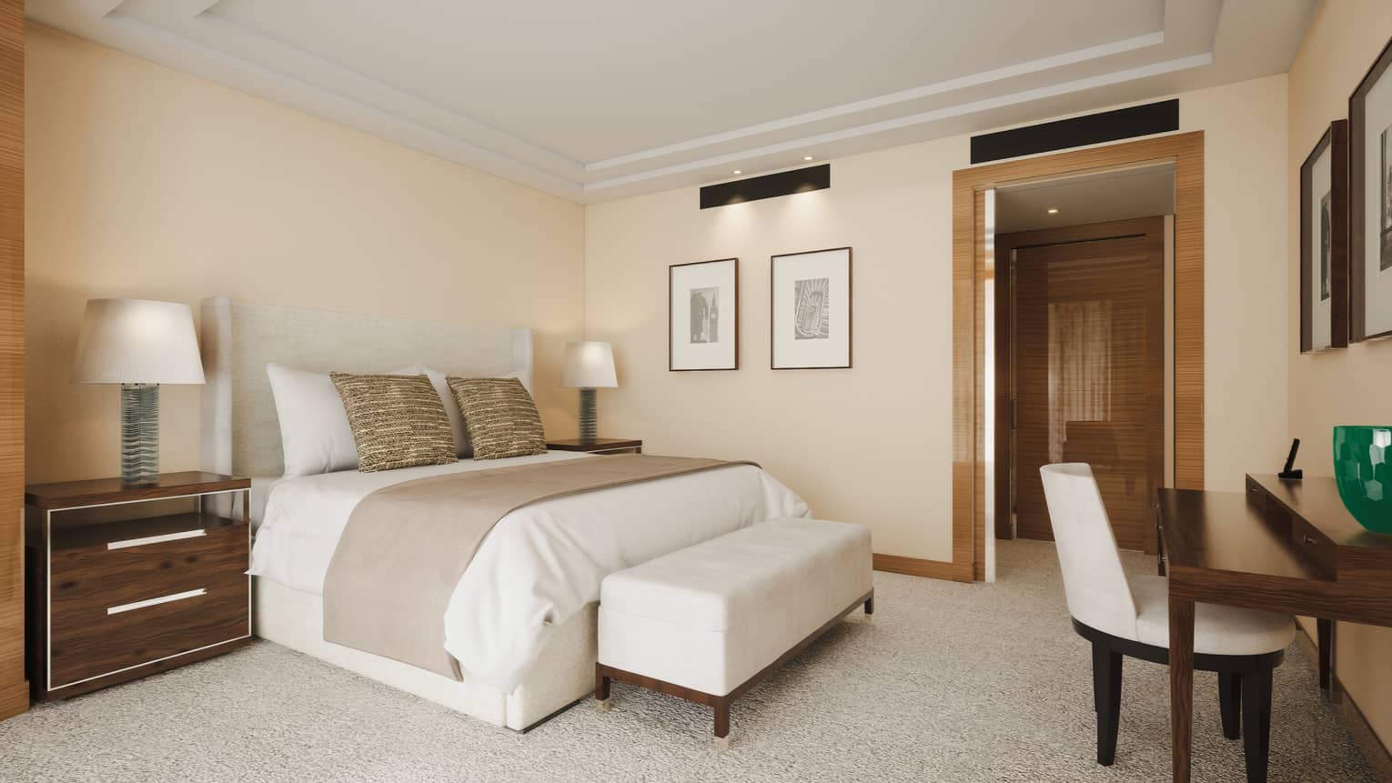 Luxury hotel suite bedroom featuring a king bed, bedside table, desk and chair