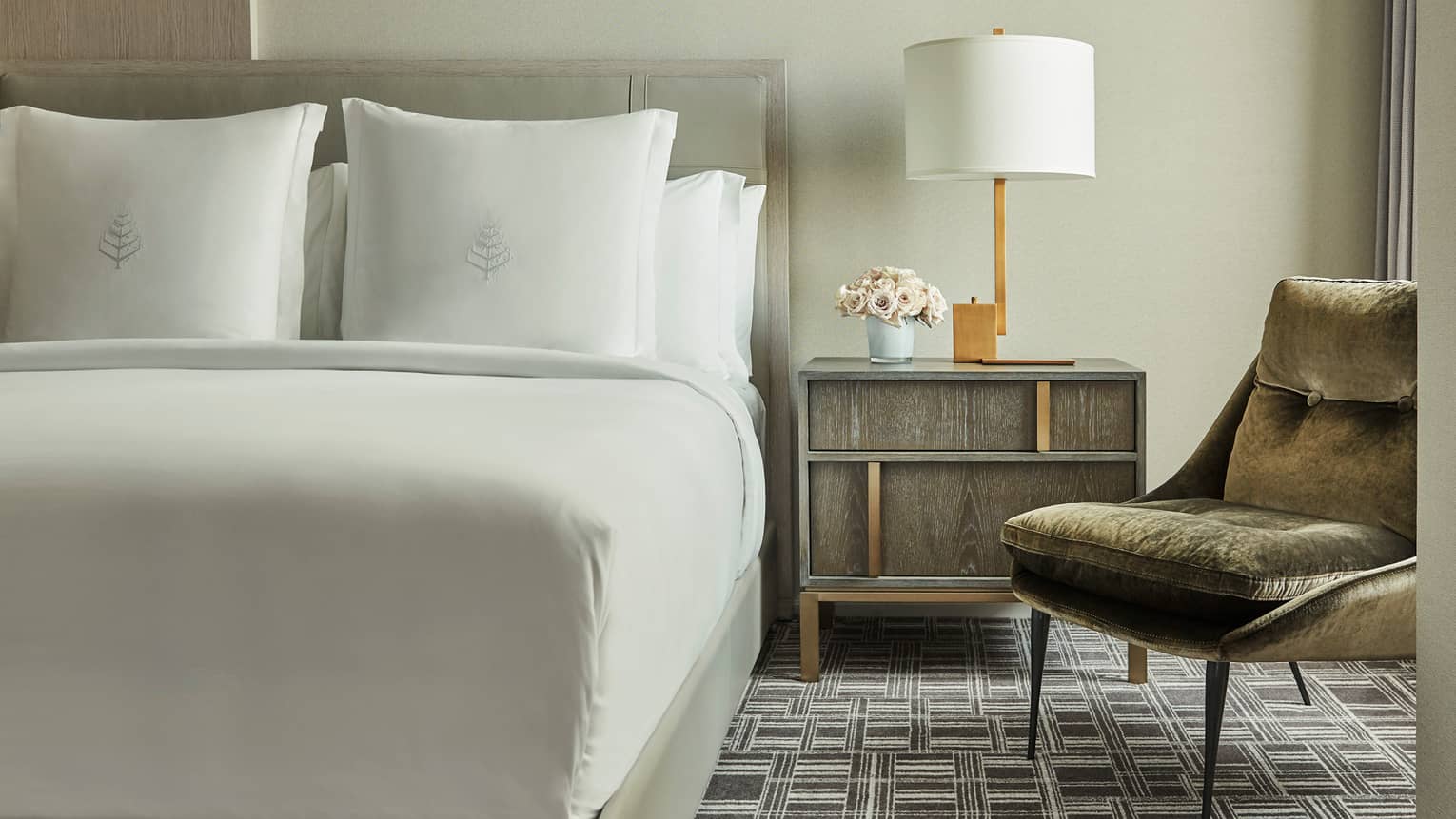 Superior Room bed, nightstand with lamp, mid-century style velvet armchair