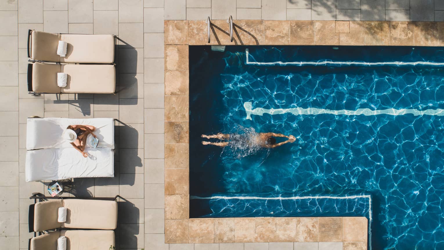 Aerial view of woman swimming in the pool