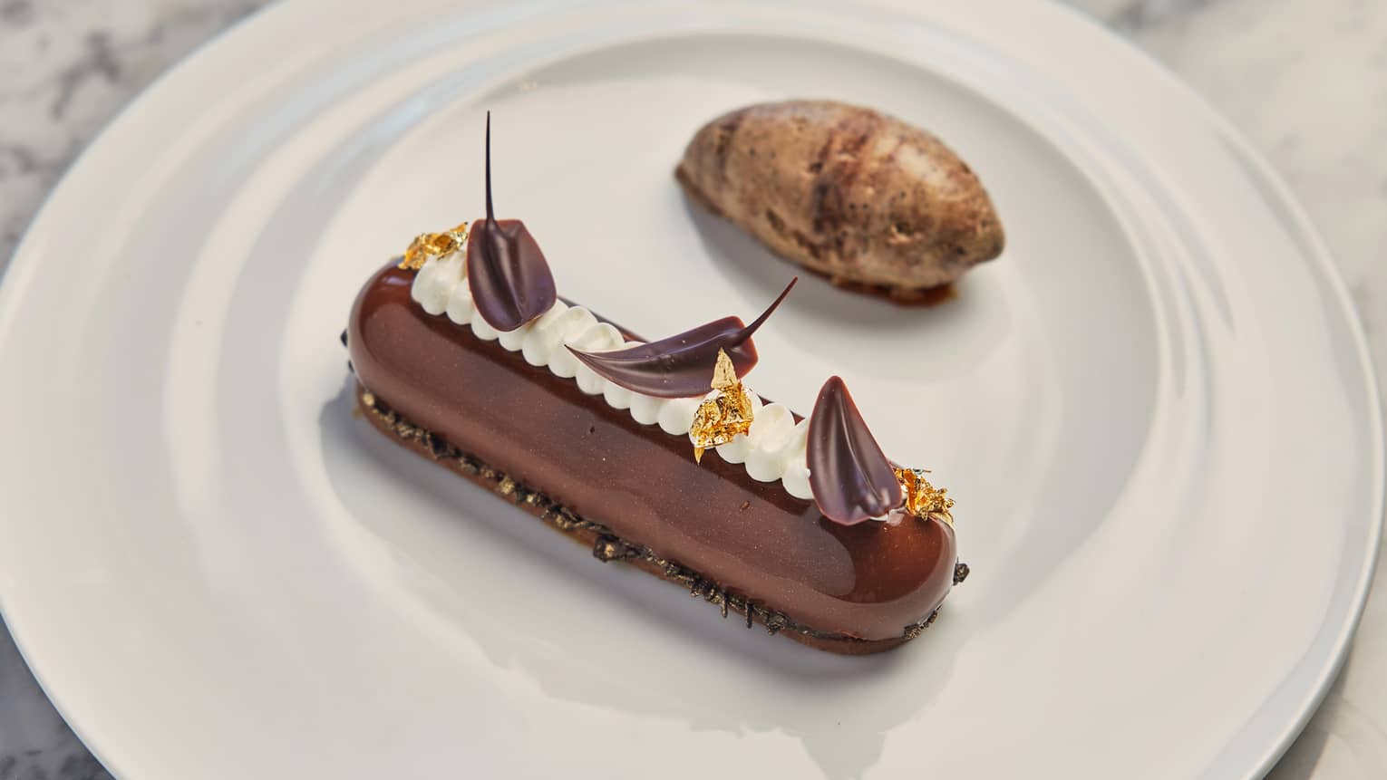 A chocolate cake with a vanilla cream.