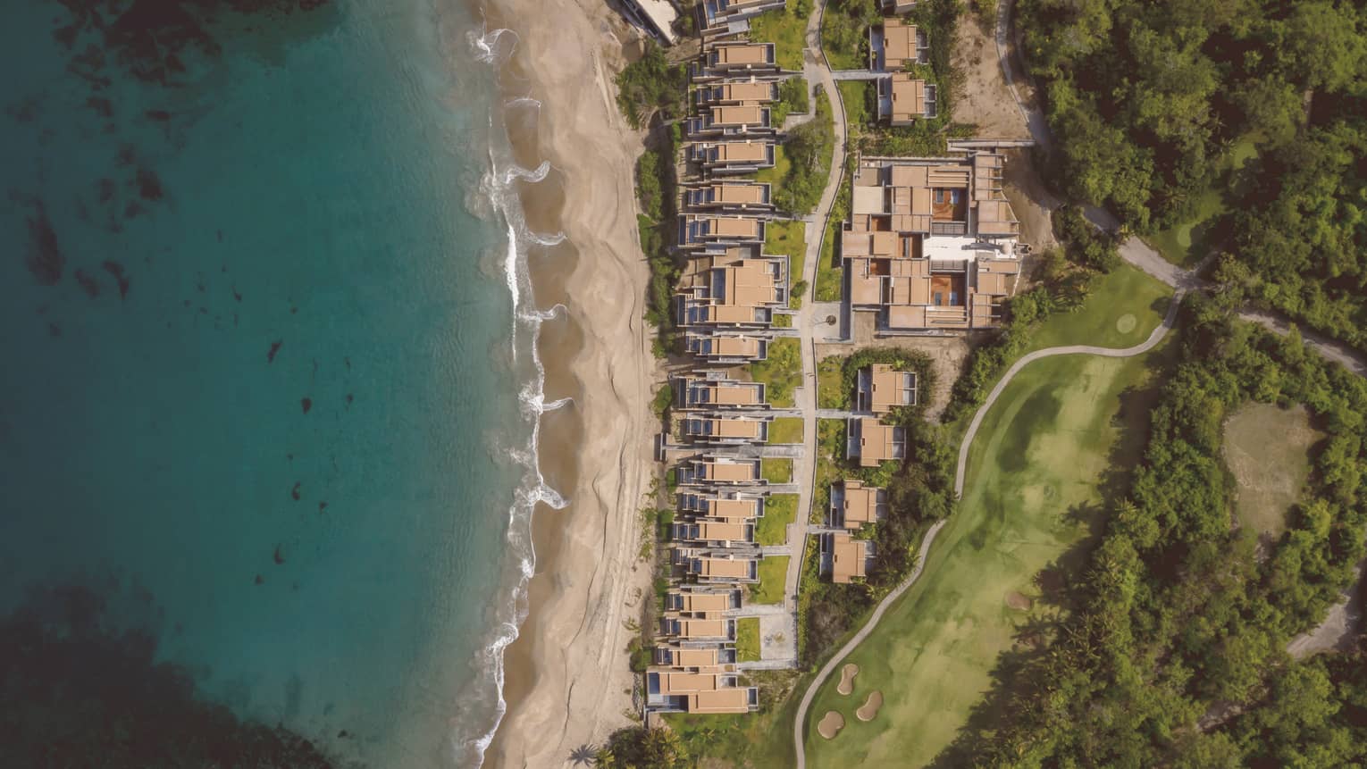 Aerial view of hotel villas close to the beach