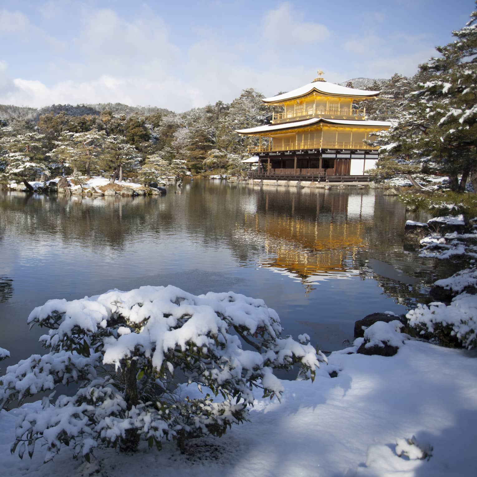 Golden Temple in Kyoto Japan covered with snow by the lake