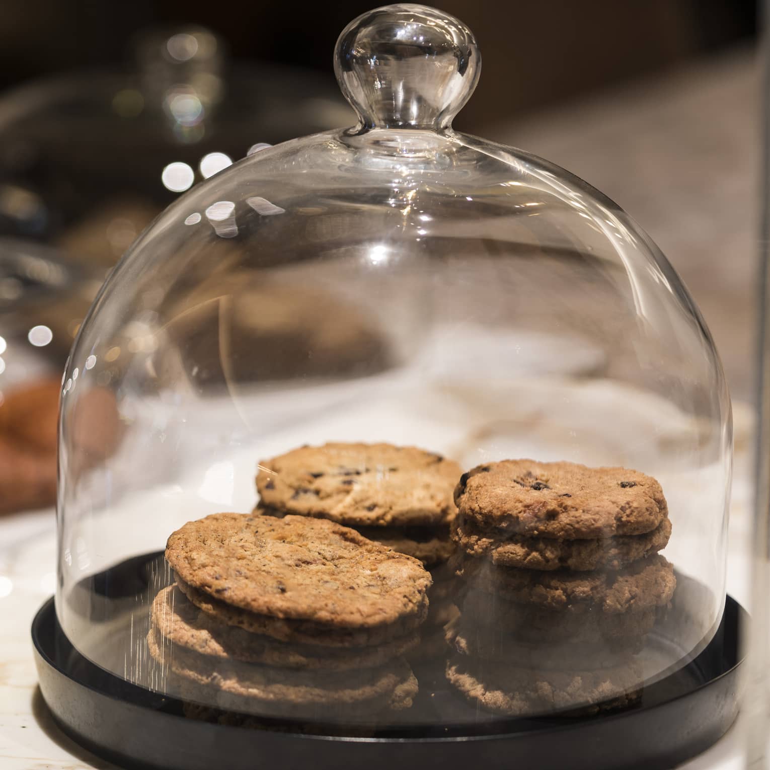 Cookies under a glass cover.