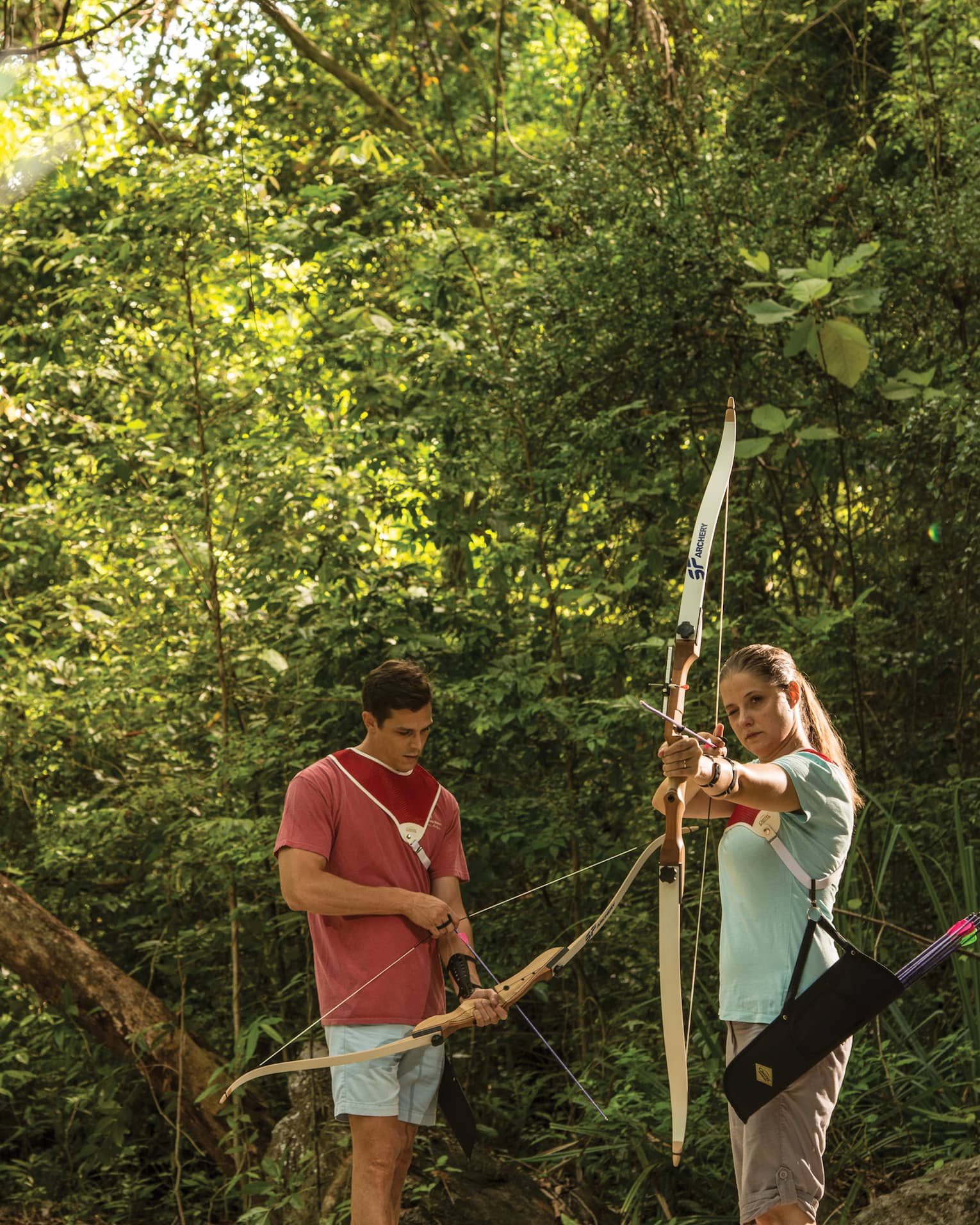 Couple practices archery in the Langkawi jungle