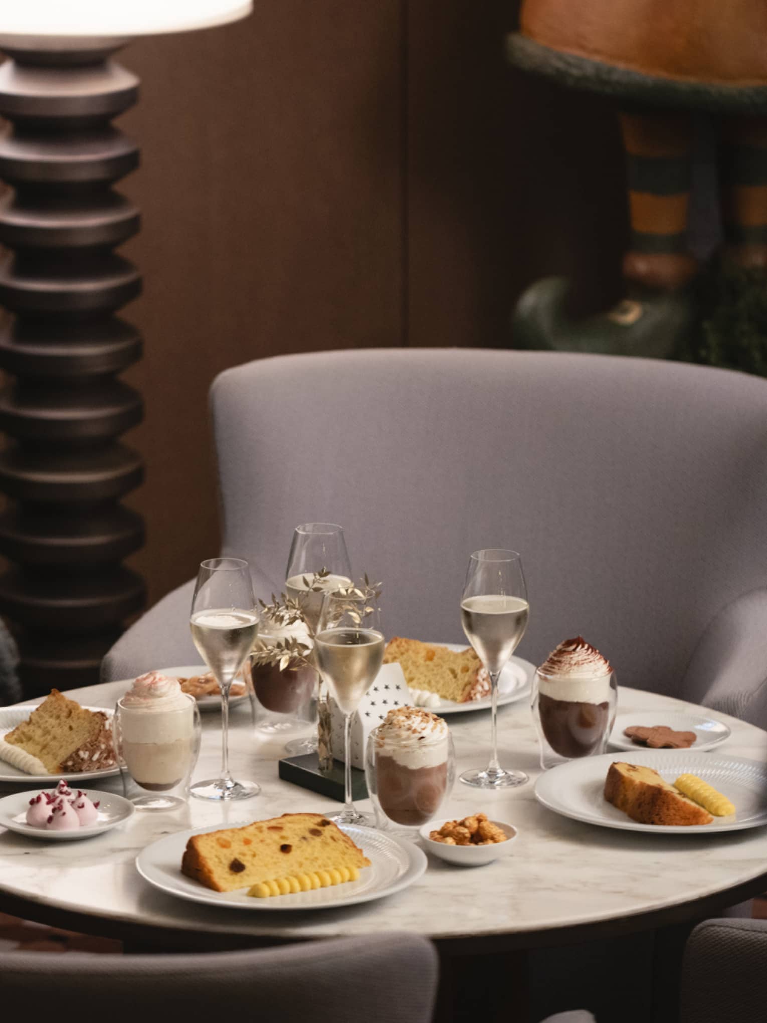 A dining table set with festive food items and beverages