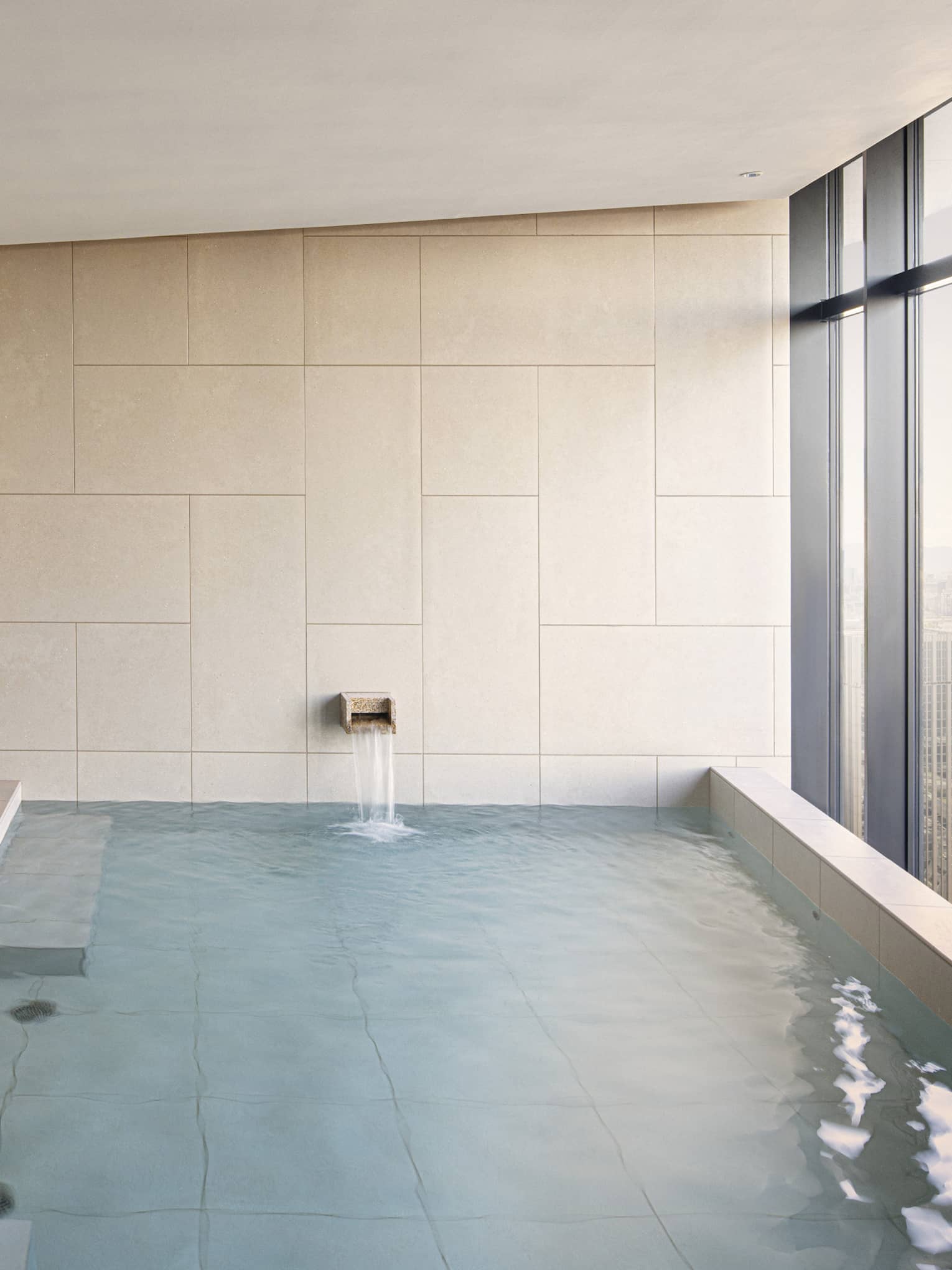 Four Seasons Hotel Osaka Japanese ofuro tub with wall of windows looking out to Osaka city