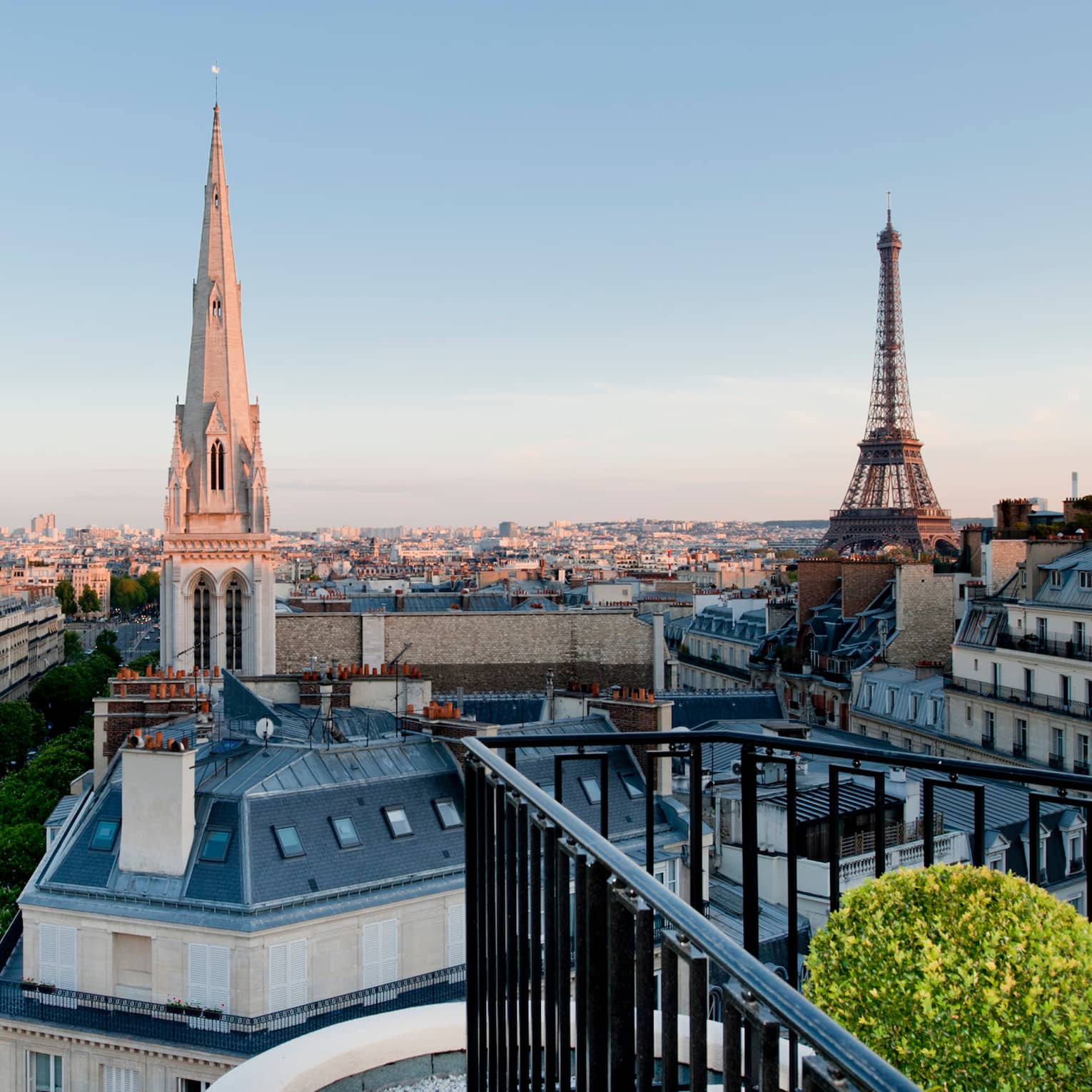 View over Paris rooftops, cathedral towers, Eiffel Tower