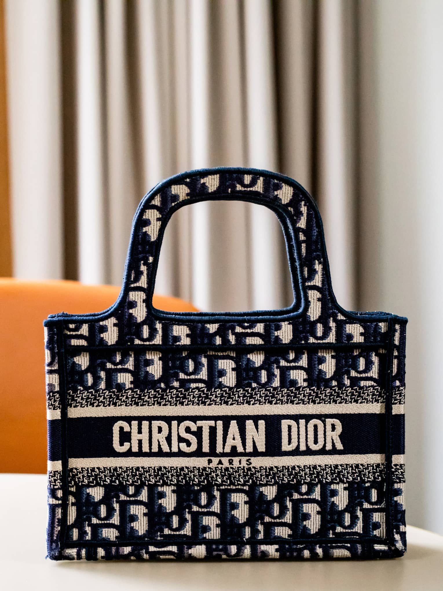 A bag with a Christian Dior label on it.