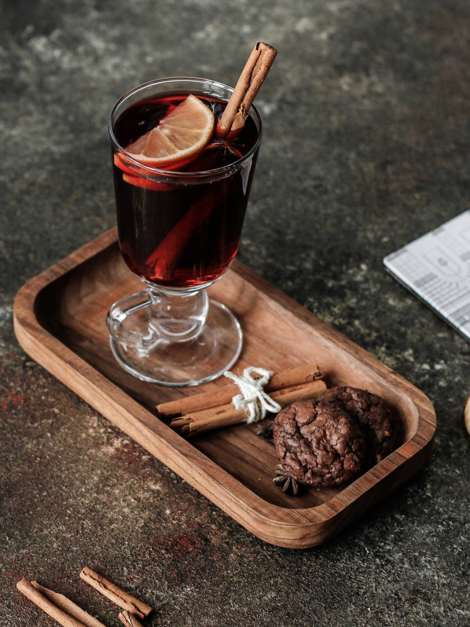 Glass of mulled wine with cinnamon stick and orange slice